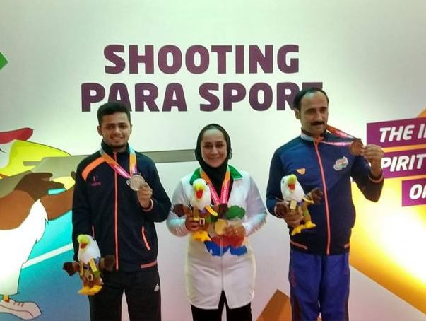 India's 17-year-old Manish Narwal, left, wants to hold junior and senior world records by next year, when he hopes to challenge for a shooting medal at the Tokyo 2020 Paralympics