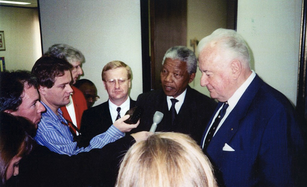 John Coates, seen here with Nelson Mandela, said a possible Brisbane/South-east Queensland bid for the 2032 Olympic and Paralympic Games was 