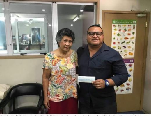 Beatrice Ott presents a cheque for $100,000 to  Tagaloa Su’a Faafouina Su’a, director of sponsorship for the Samoa 2019 Pacific Games ©Samoa 2019