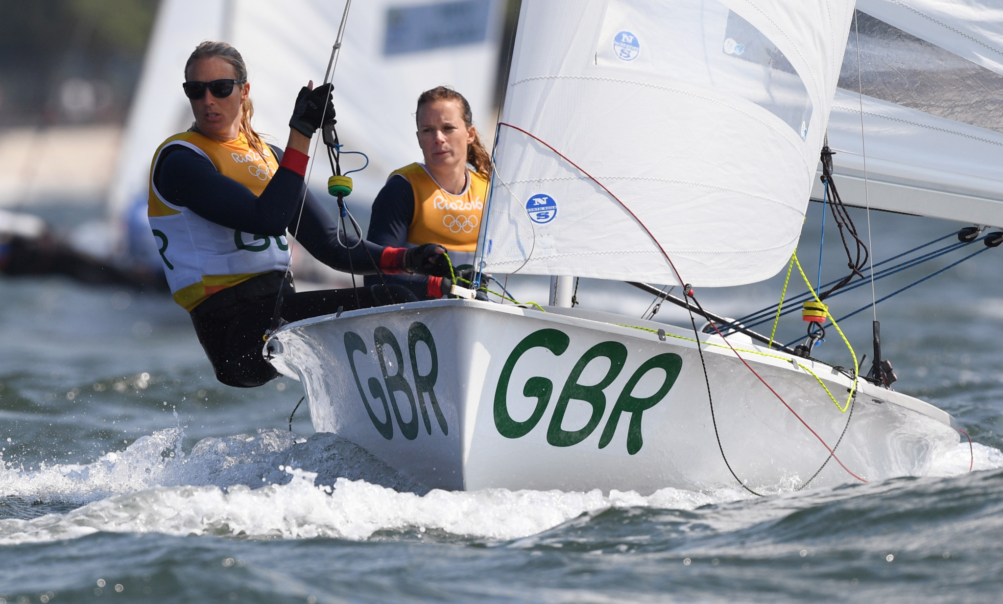 Great Britain's Hannah Mills, pictured here with Saskia Clark, and Eilidh McIntyre‏ lead the way in the women's standings ©Getty Images