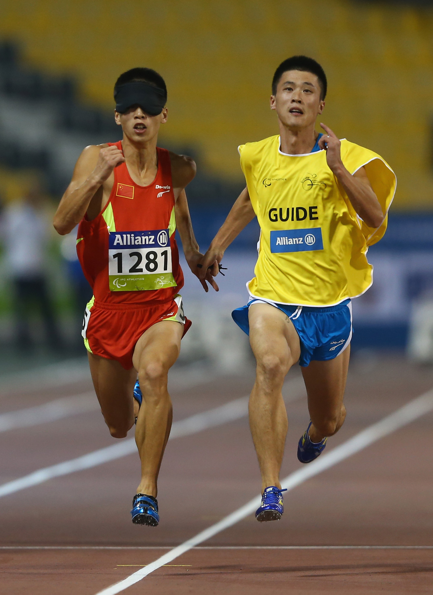 China's Dongdong di, pictured with guide, the triple Asian Games champion, won gold on day one of the World Para Athletics Grand Prix in Beijing ©Getty Images