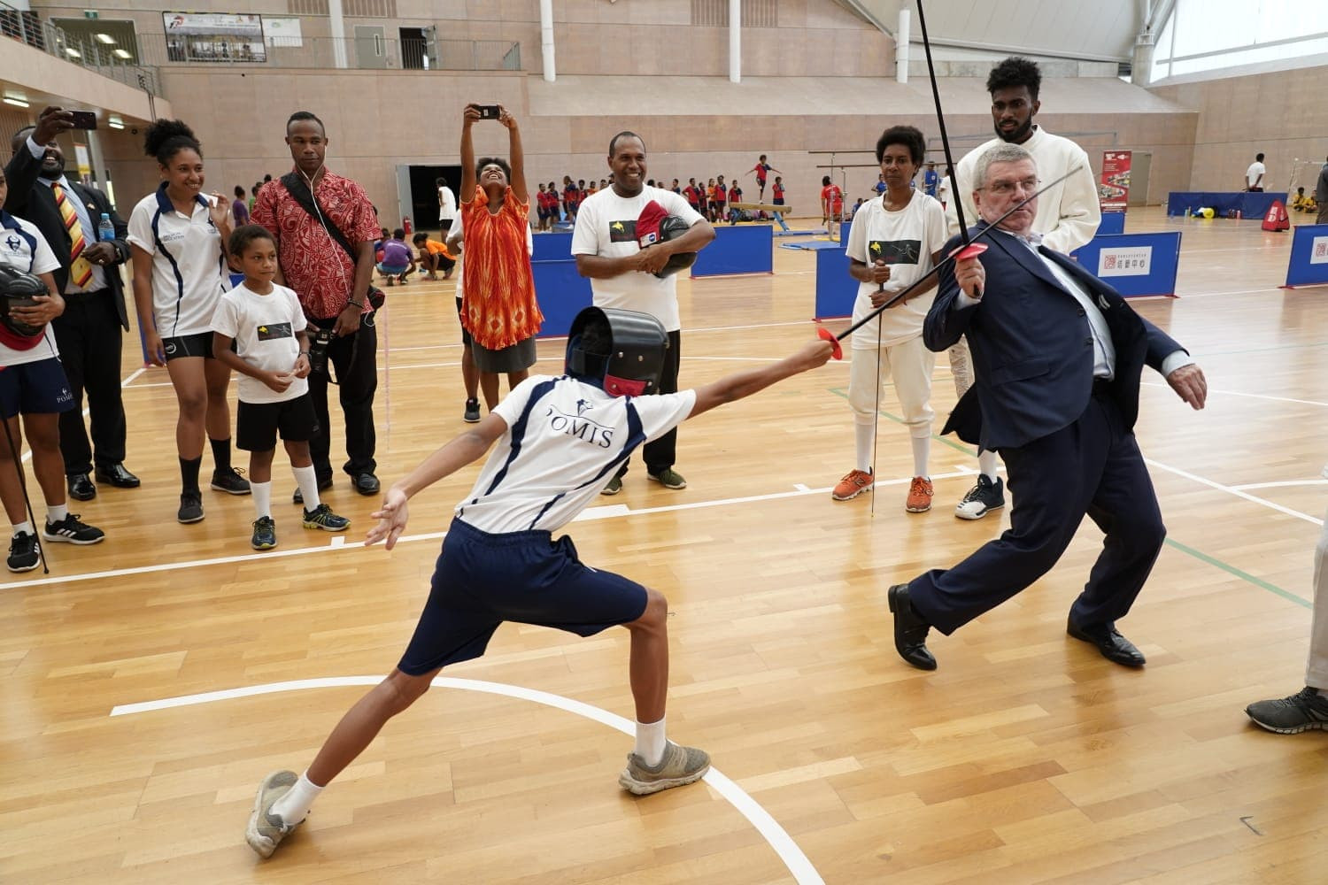 IOC President Thomas Bach visited Taurama Aquatic and Indoor Centre in Papua New Guinea, where he displayed his fencing skills ©Facebook