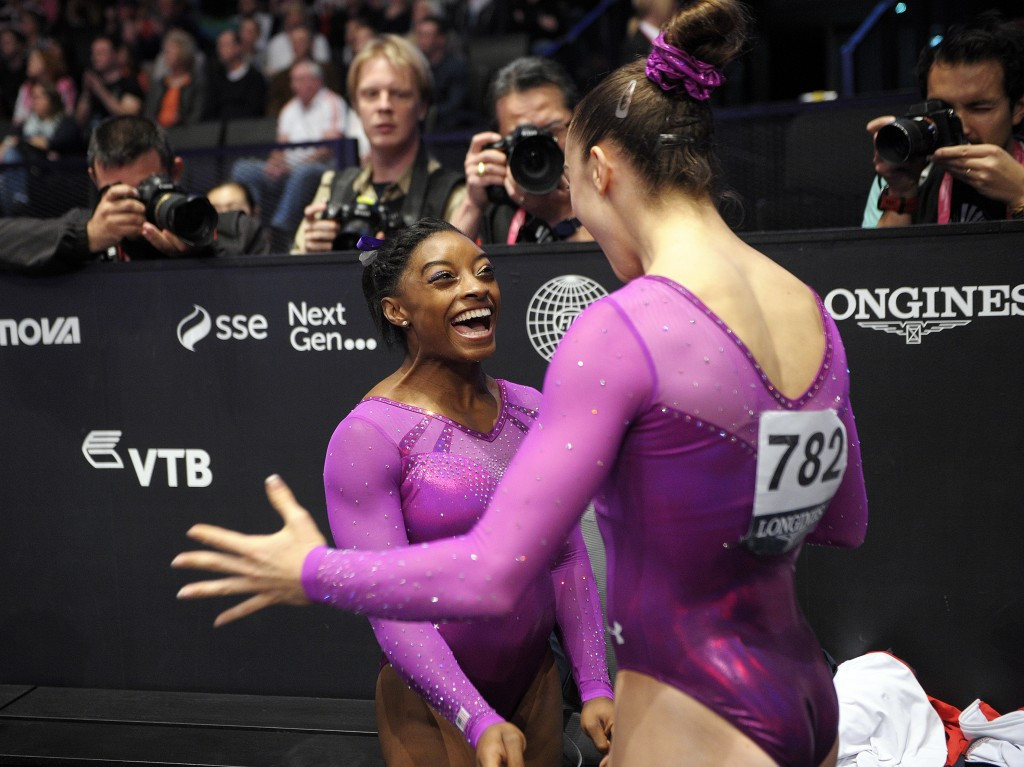 Americans Simone Biles and Maggie Nichols embrace after each securing a medal on the floor ©Getty Images
