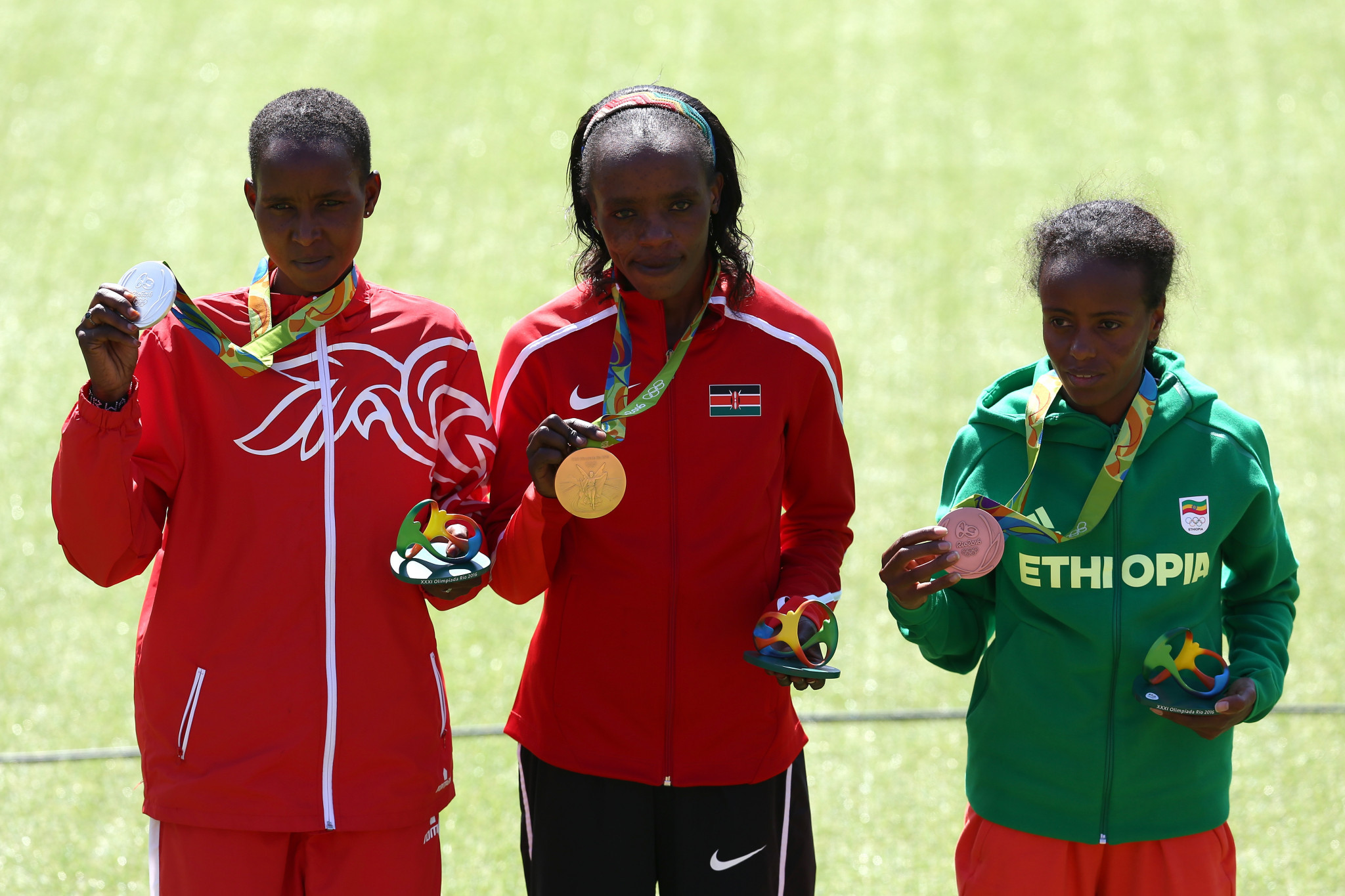 Both the gold and silver medallists in the women's marathon at Rio 2016 have now been implicated in doping following news that Eunice Kirwa, left,was provisionally suspended after testing positive for EPO, joining Kenya's Jemima Sumgong, centre, the winner, already banned for eight years ©Getty Images
