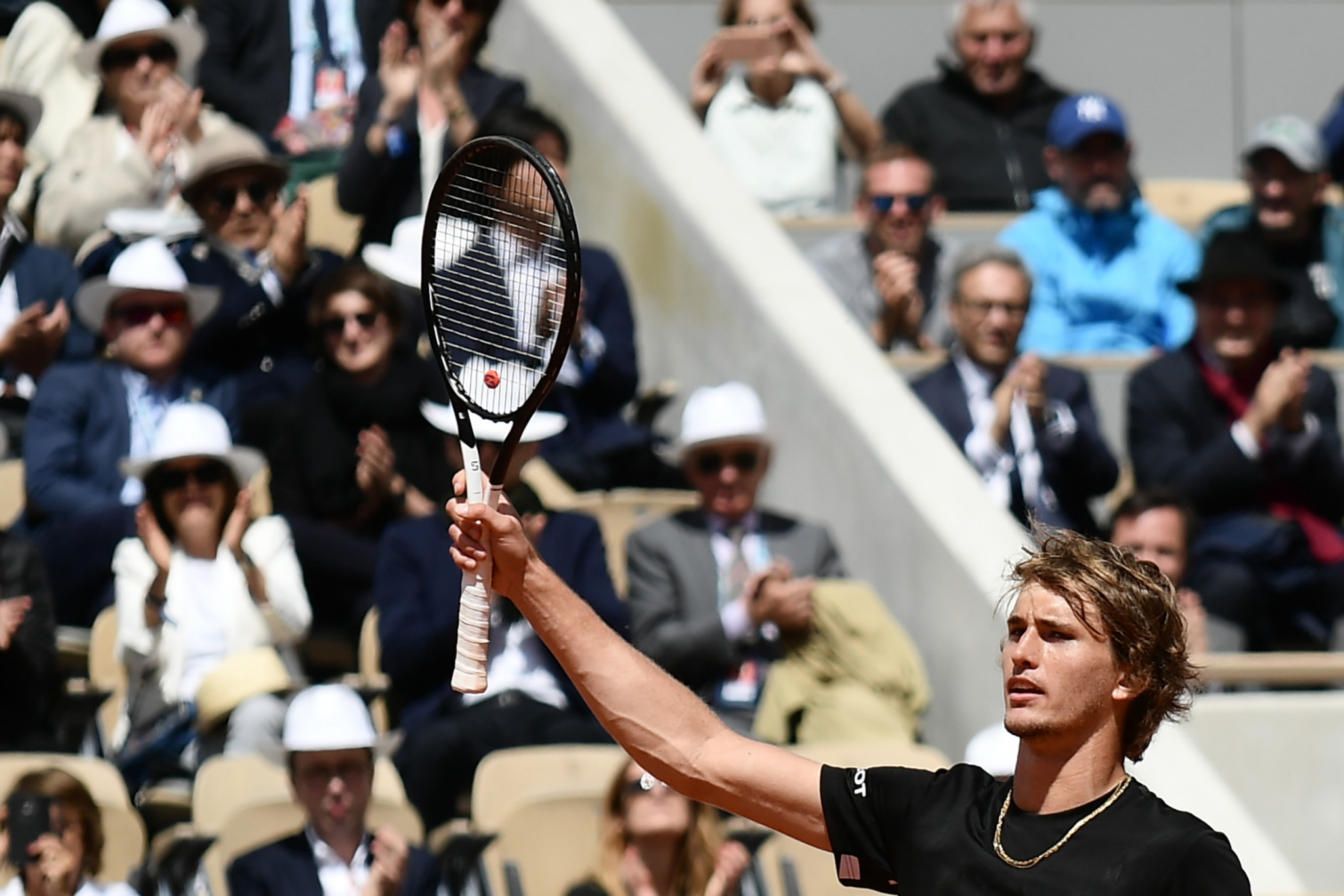 Zverev battles through frustration to reach second round  at French Open