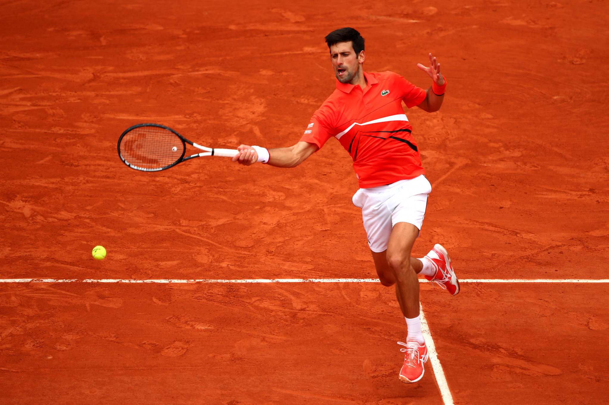 Djokovic eases into round three as women's seeds tumble at Roland-Garros 