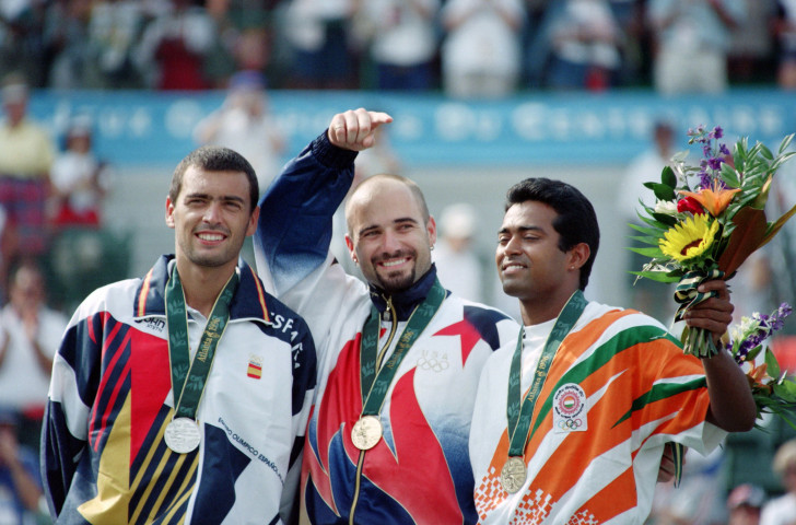 Leander Paes, pictured, right, with the bronze medal from the 1996 Atlanta Games – alongside silver medallist Sergi Bruguera of Spain and winner Andre Agassi of the United States – plans to extend his record run of Olympic tennis appearances by competing in an eighth Games in Tokyo next year ©Getty Images