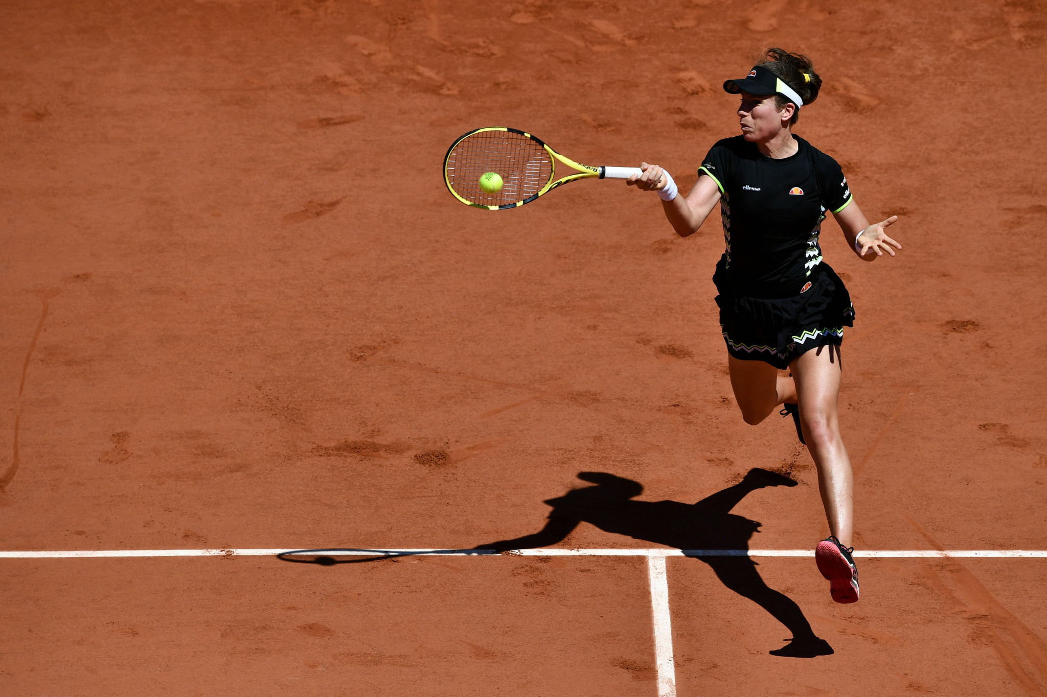 Johanna Konta of Britain gets both feet off the ground as she reaches the quarter-finals at Roland Garros for the first time ©Getty Images