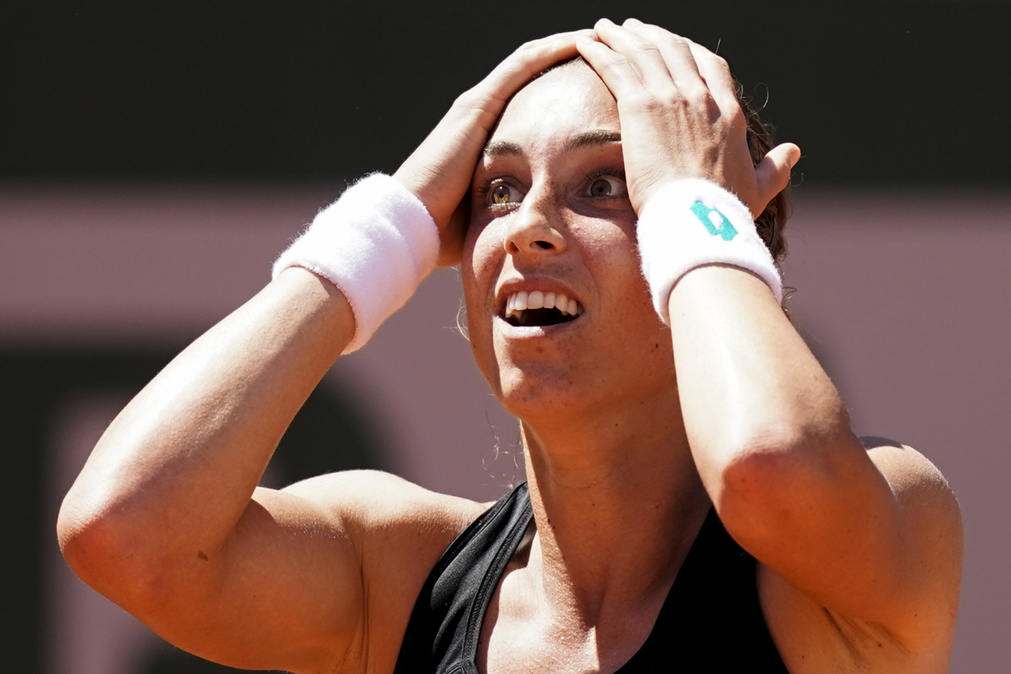 Croatian Petra Martić holds her head in disbelief after fighting back from a set down to defeat Estonia's Kaia Kanepi and reach her first French Open quarter-final ©Getty Images