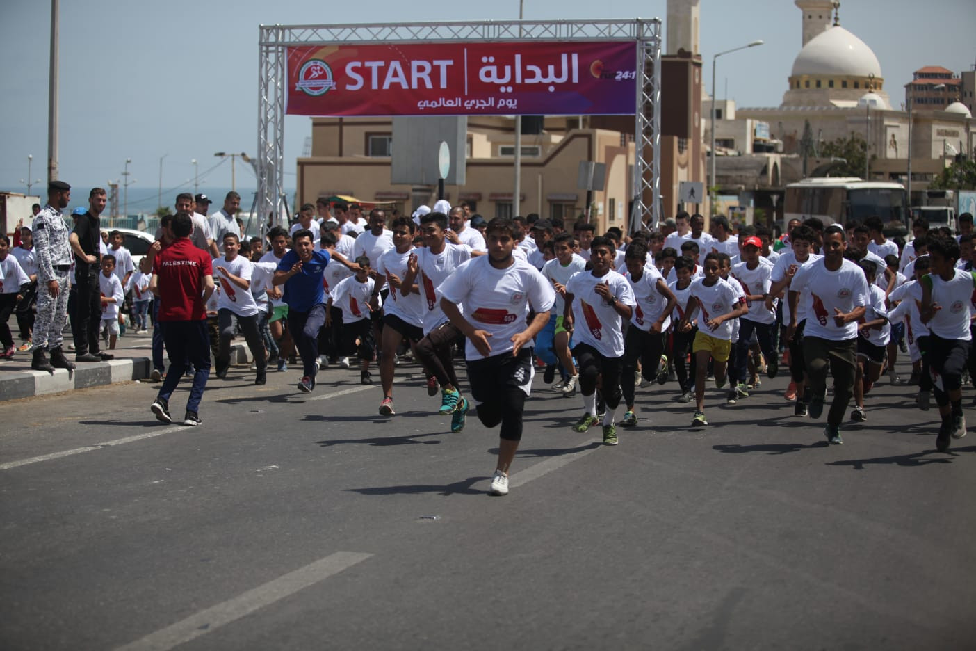 Around 400 Gaza residents take their turn over the mile distance as part of IAAF Run 24-1 initiative