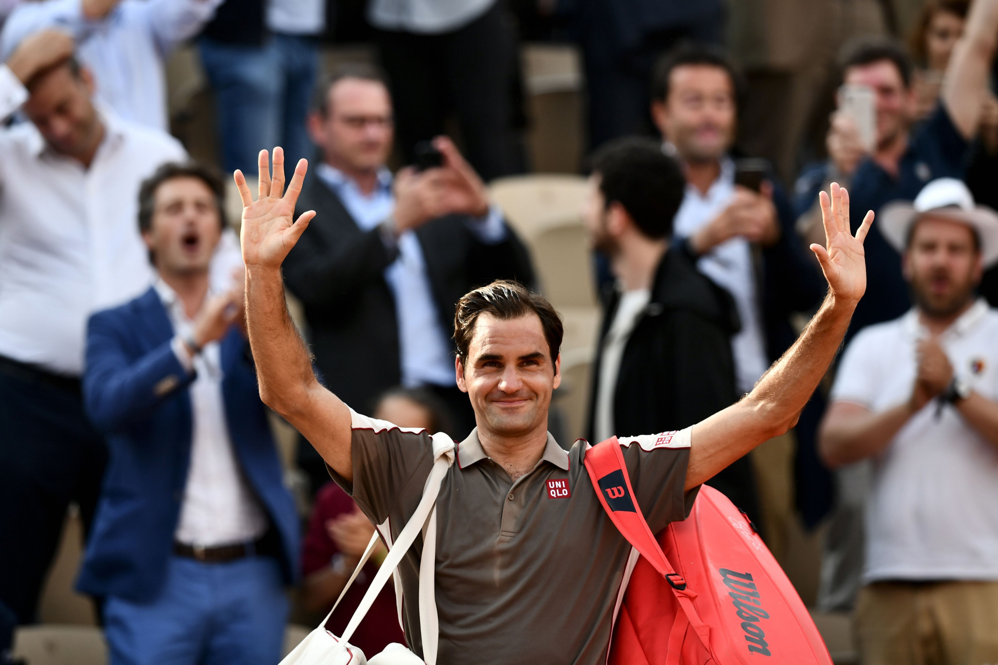 Federer through to French Open semi-finals after tough tussle with Wawrinka