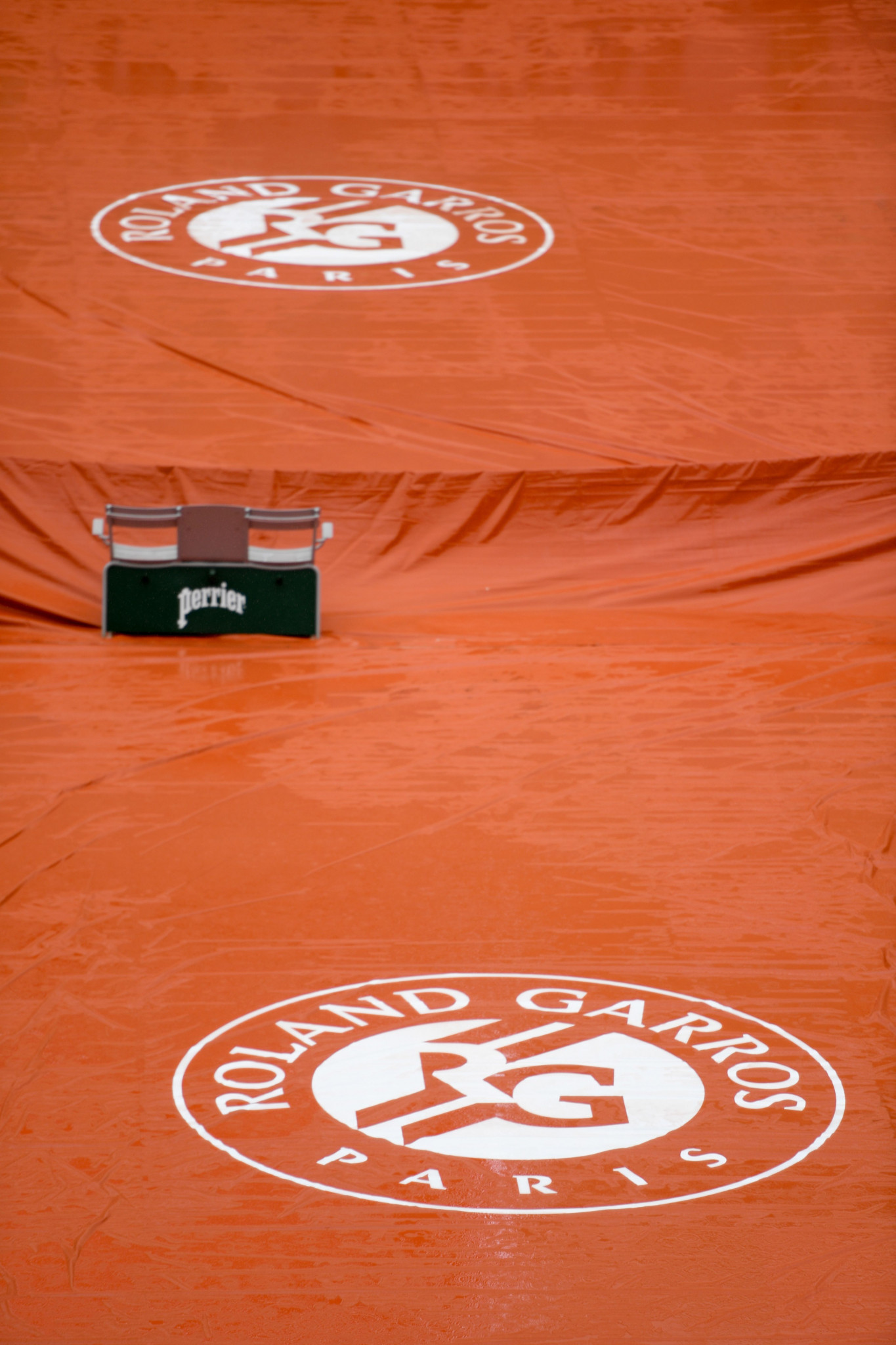 A court surface is covered as rain falls on day 11 of the French Open in Paris ©Getty Images
