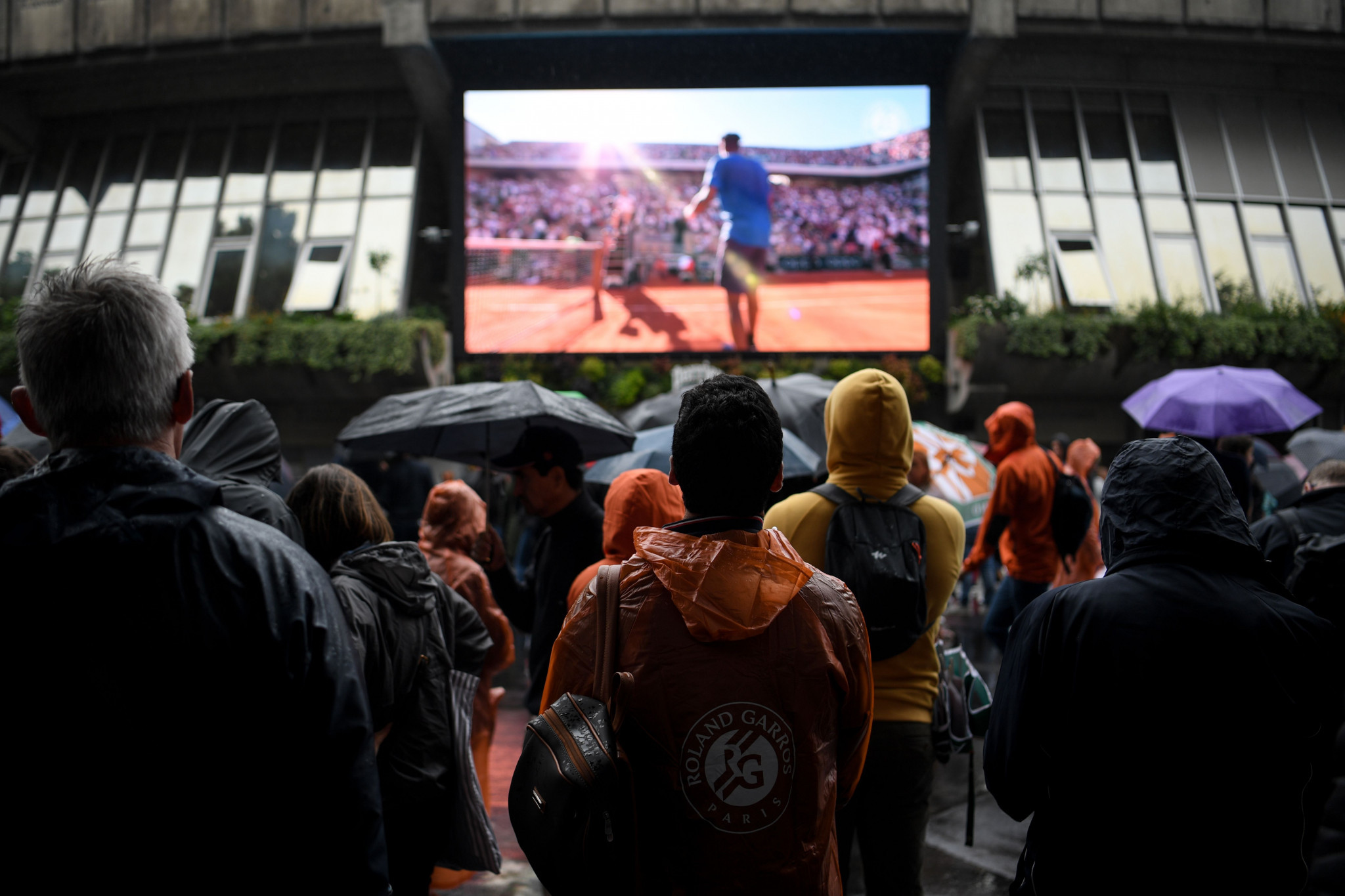 Fans had to settle for replays on the big screens as the rain poured on Roland Garros ©Getty Images