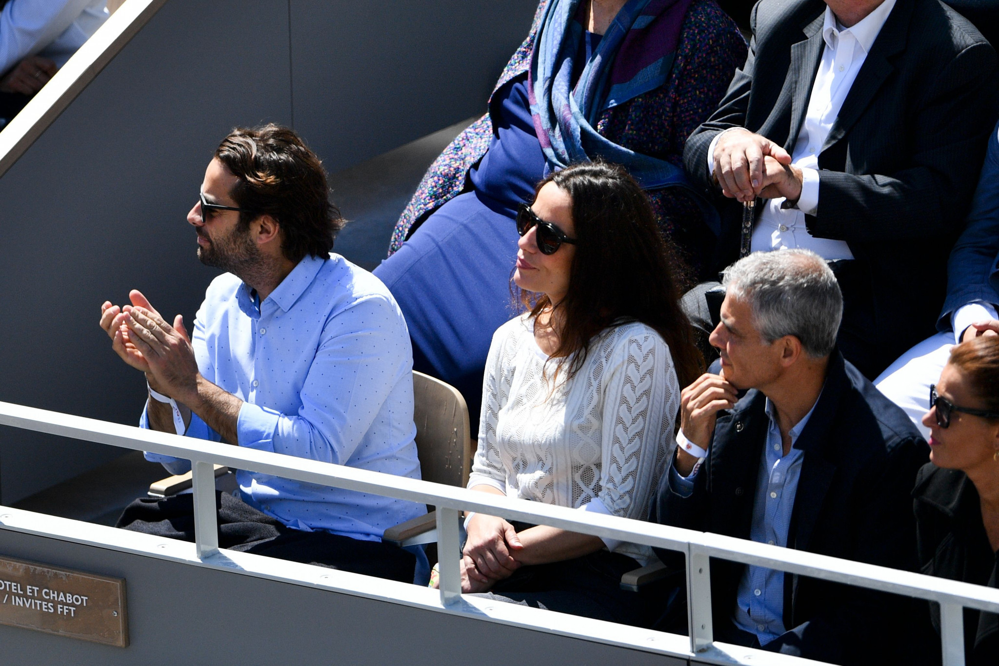 French actress Zoe Felix, centre, enjoys the men's French Open semi-final between Djokovic and Thiem ©Getty Images