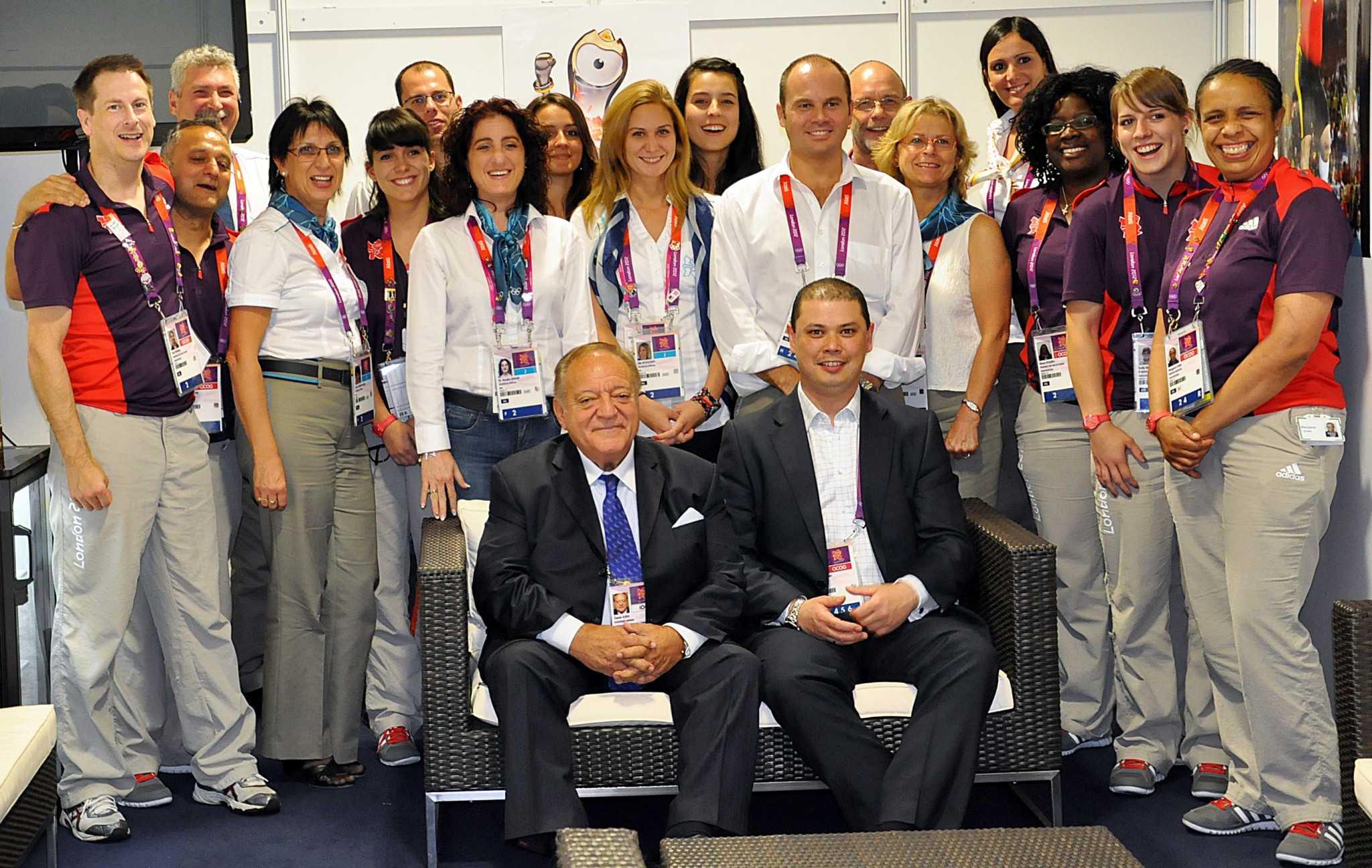 Matthew Curtain, right, seated right, with IWF President Tamás Aján, left, and his team at London 2012 where he was the manager for the weightlifting competition ©IWF