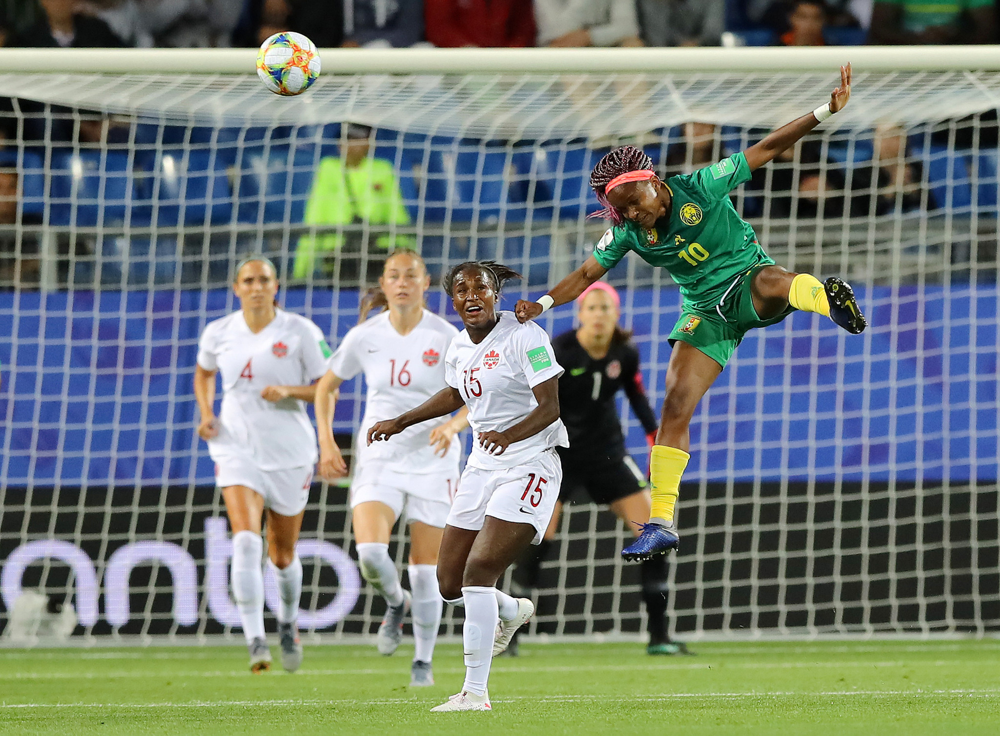 Jeannette Yango of Cameroon wins a header against Canada at Stade de la Mosson, Montpellier ©Getty Images 