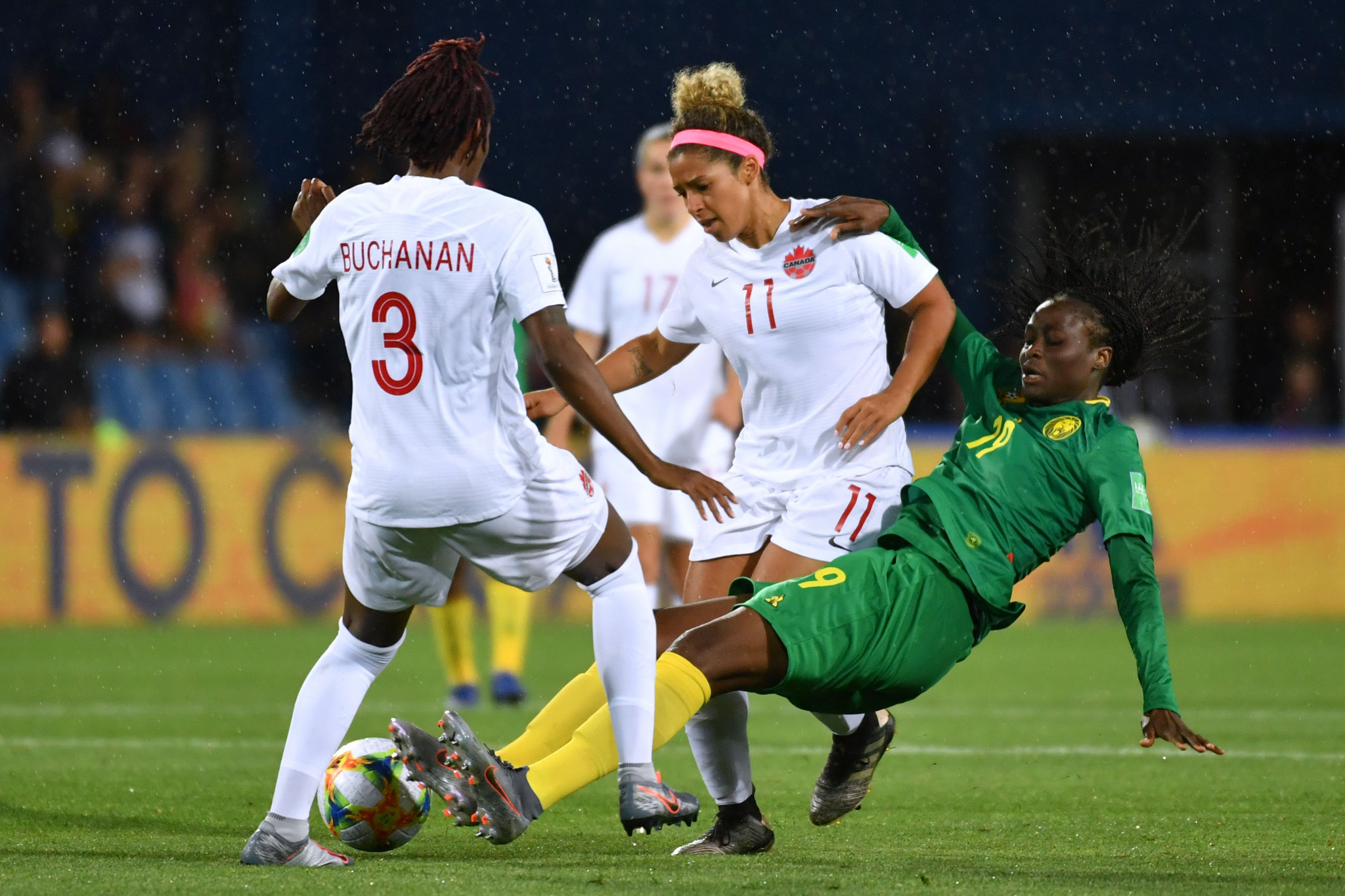 Kadeisha Buchanan of Canada goes in for a tackle on Cameroon's Marlyse Ngo Ndoumbouk ©Getty Images 