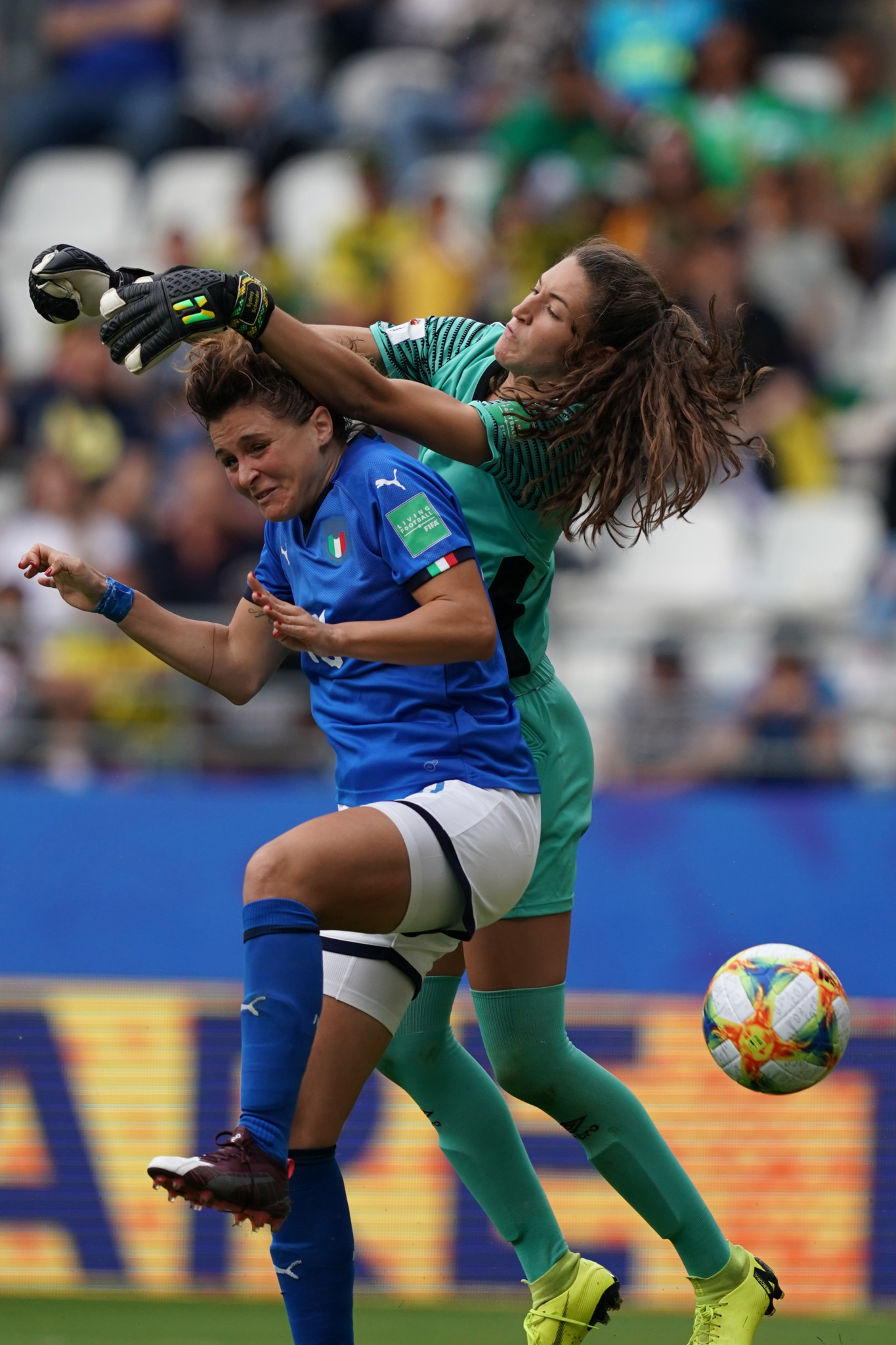 Italy forward Cristiana Girelli, left, completes her hat-trick despite pressure from Jamaica goalkeeper Sydney Schneider ©Getty Images