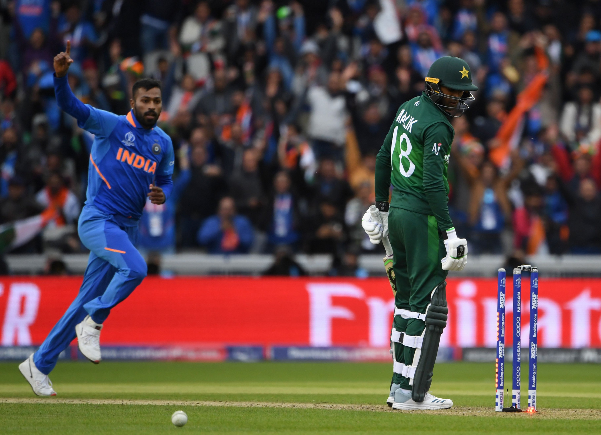 Hardik Pandya, left, and Kuldeep Yadav took two wickets each as India defeated their neighbours and rivals in Manchester © Getty Images
