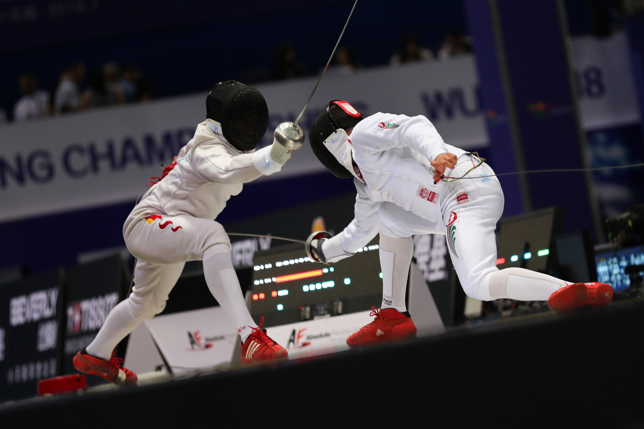 Gaofeng Shi, left, was part of China's victorious men's team épée trio ©Getty Images
