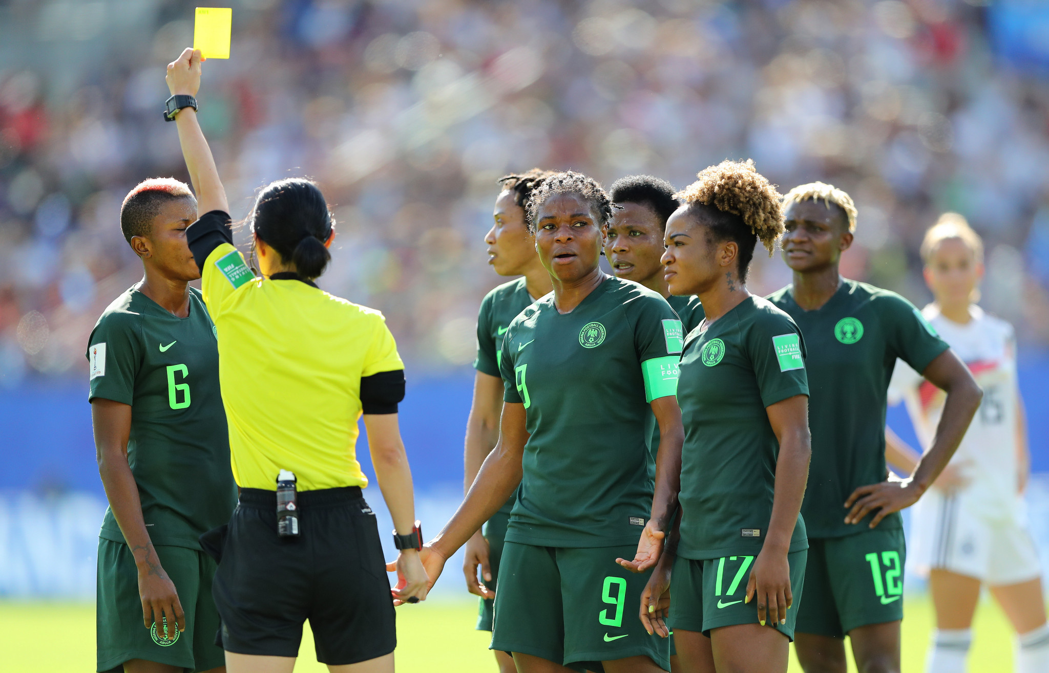 Referee Yoshimi Yamashita shows Evelyn Nwabuoku a yellow card after awarding a penalty against Nigeria via VAR ©Getty Images