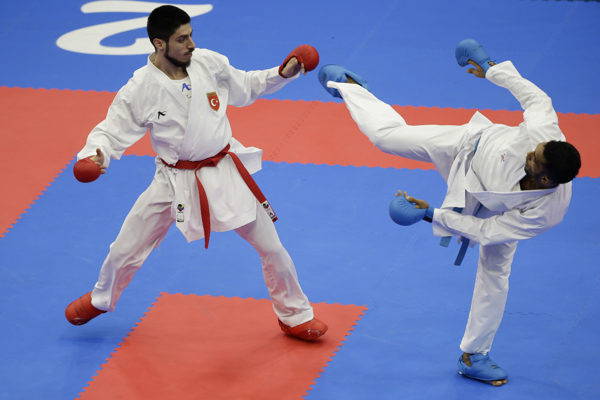 Erman Eltemur, left, knocked out reigning world champion Bahman Asgari Ghoncheh to reach the men's under-75kg final ©Getty Images