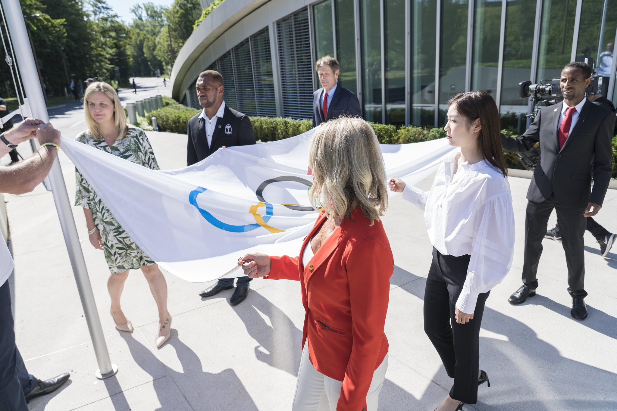 The Olympic Flag was carried into the ceremony by athletes ©IOC