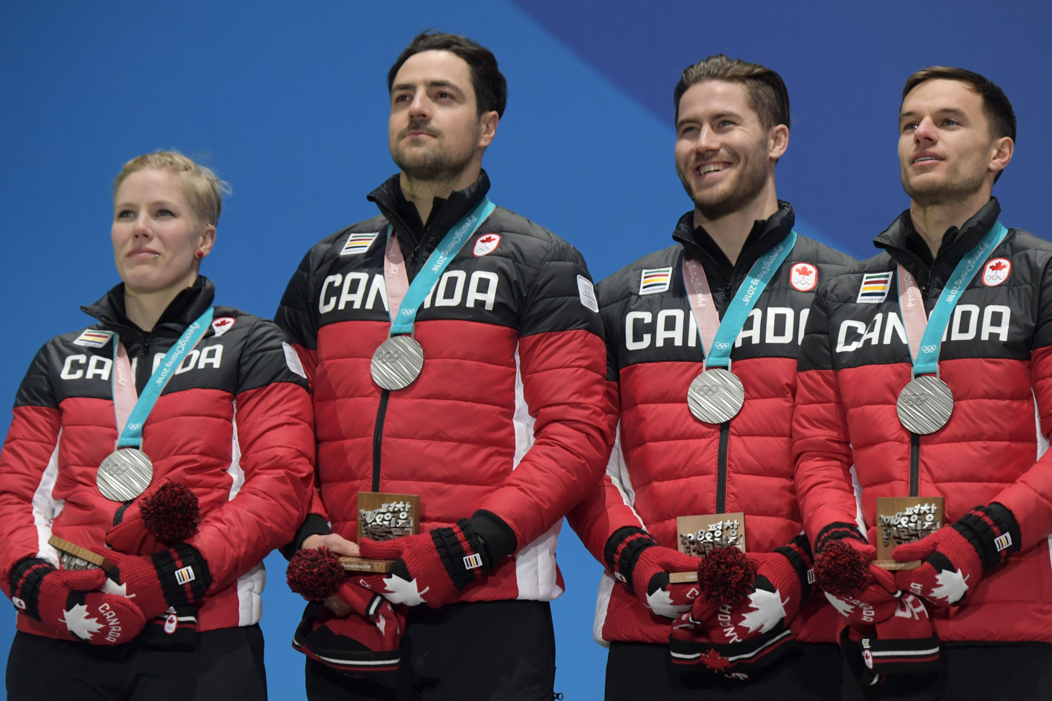 Canada's silver medallists Alex Gough, Sam Edney, Tristan Walker and Justin Snith pose on the podium during the medal ceremony at Pyeongchang 2018 ©Getty Images