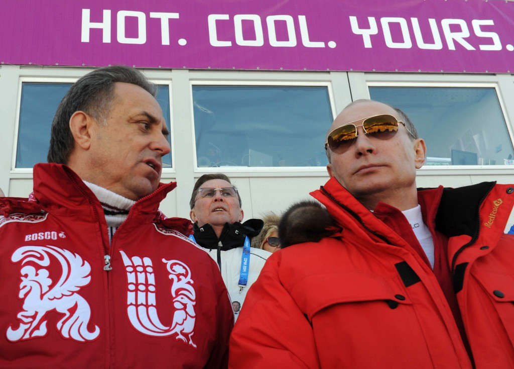 Russian President Vladimir Putin (right) appears set to stand behind long-time ally, Sports Minister Vitaly Mutko, labelled as being 