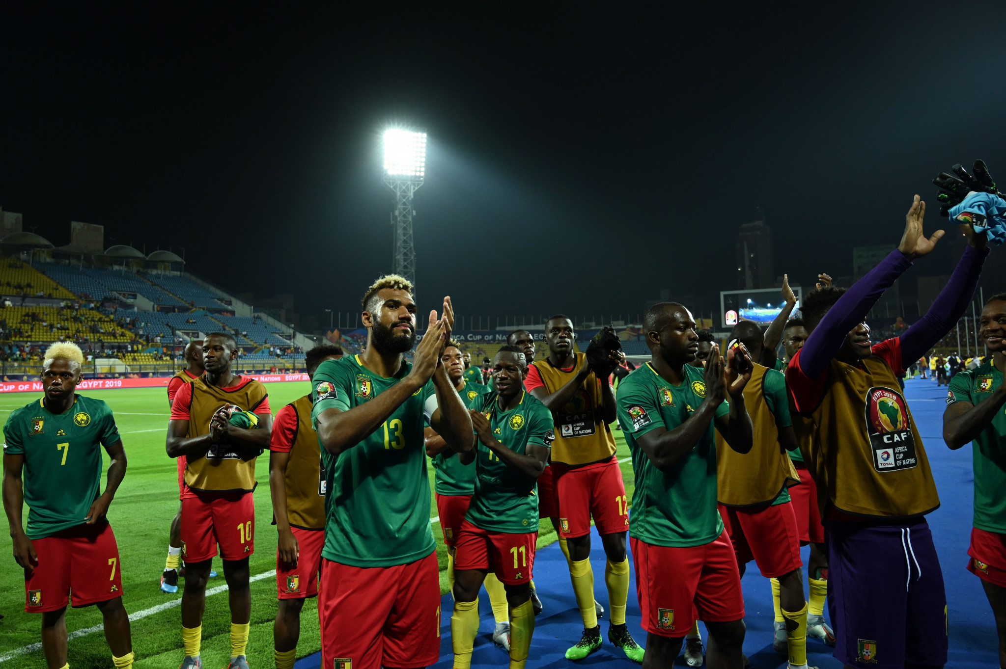 Cameroon players applaud their fans after drawing with Ghana ©Getty Images