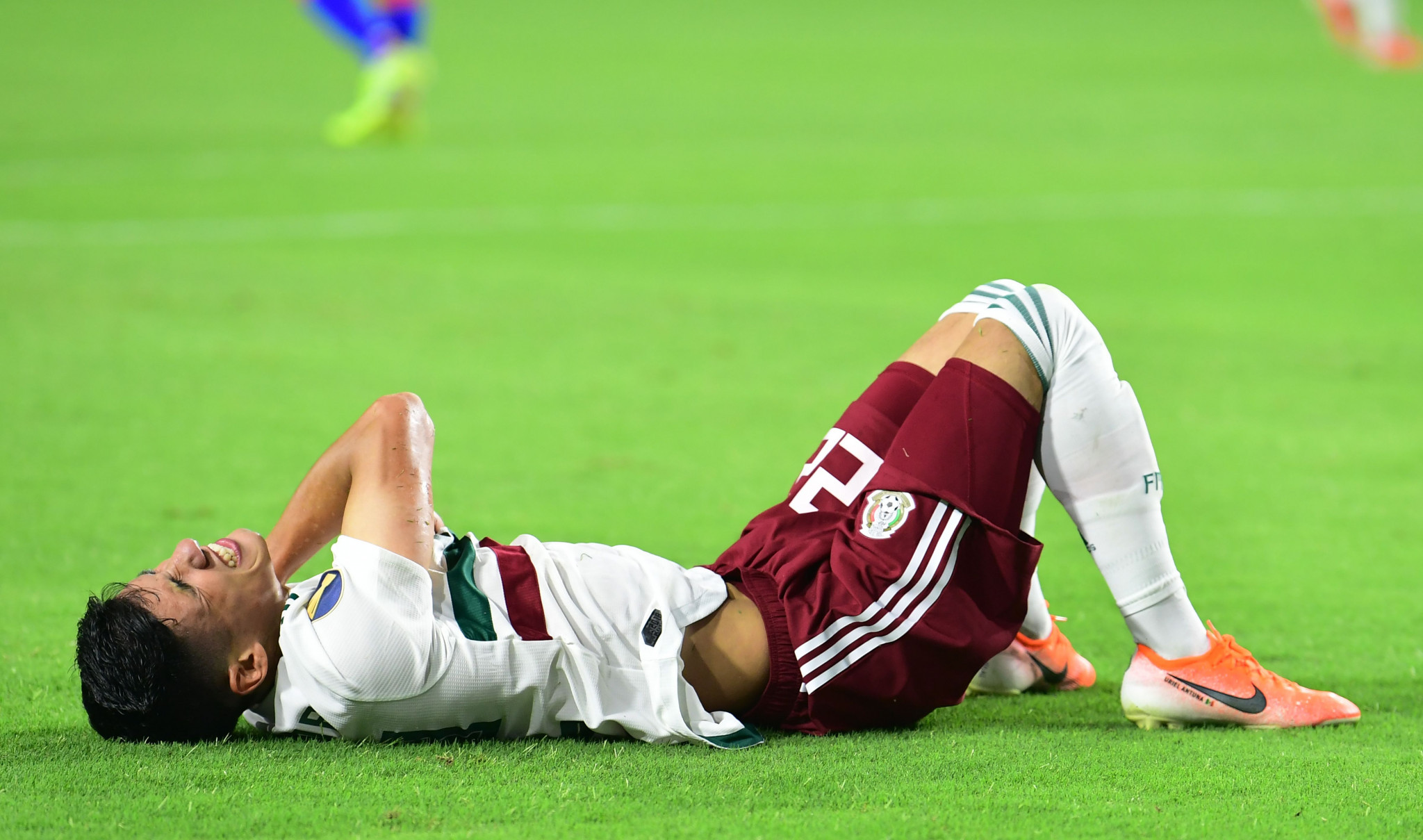 Mexico forward Uriel Antuna is in pain after taking a tumble in the CONCACAF Gold Cup final ©Getty Images