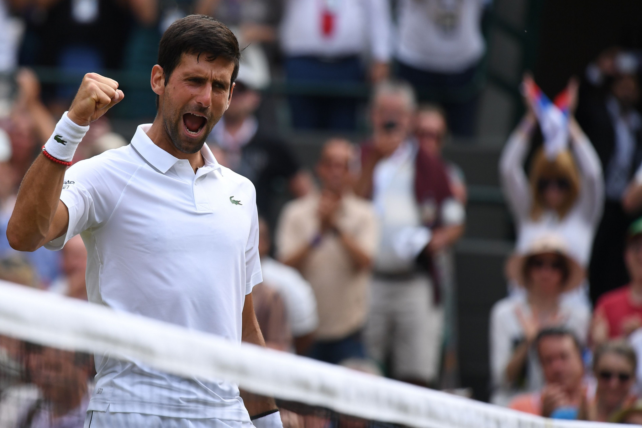 Defending champion Djokovic through to fourth round at Wimbledon