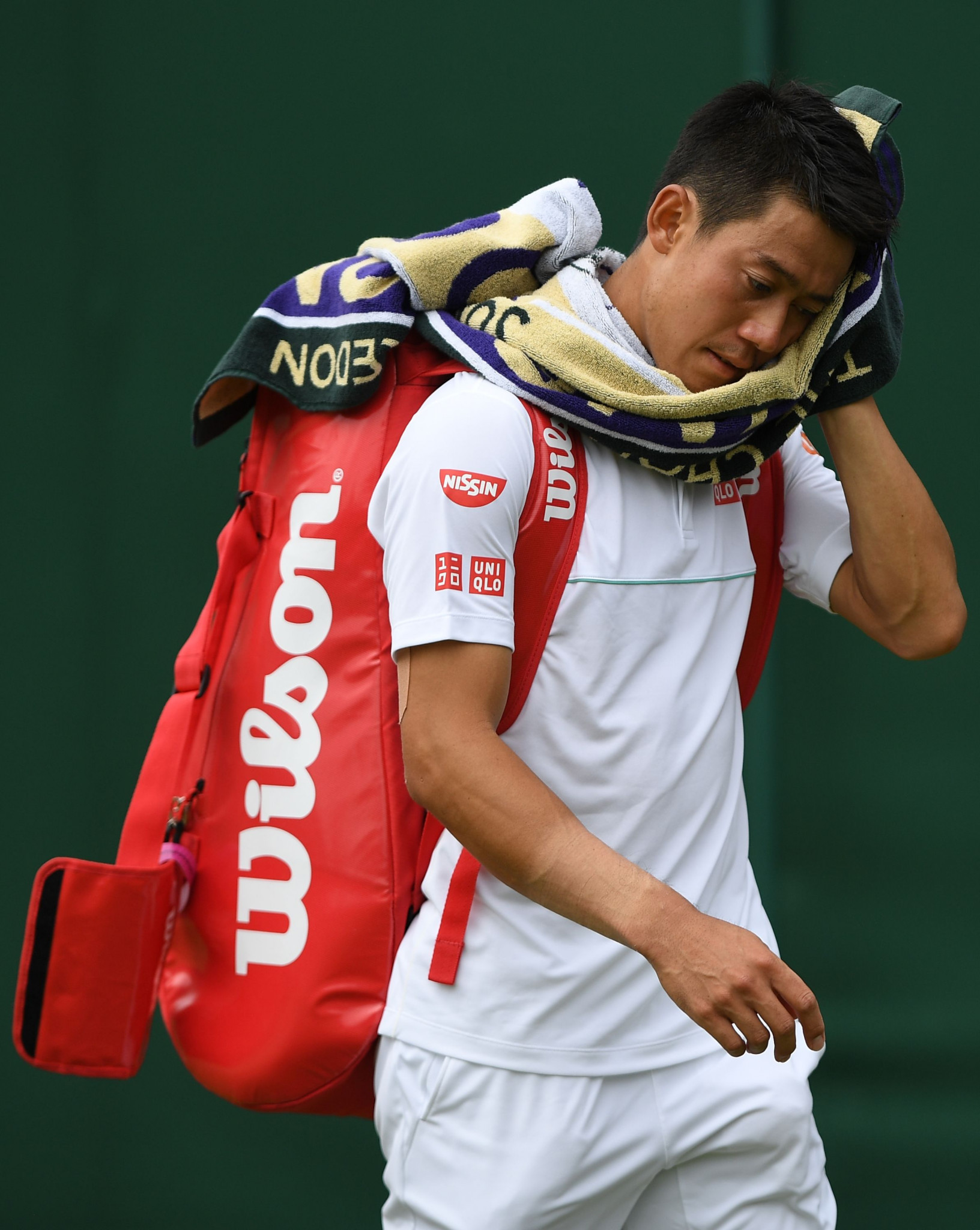 Japan's Kei Nishikori cools off after defeating the United States' Steve Johnson ©Getty Images