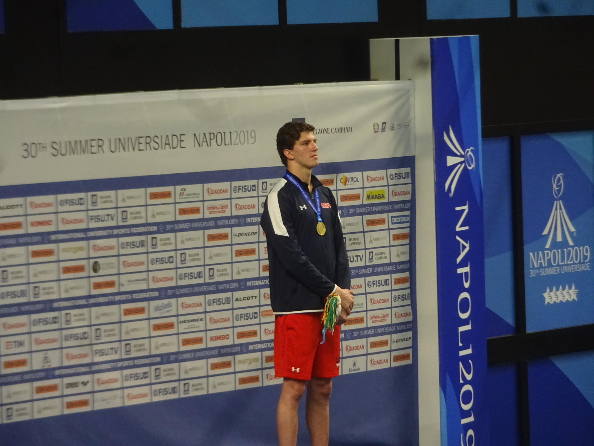 United States swimmer Zach Apple receives his Universiade 200m freestyle gold medal at Piscina Scandone ©Philip Barker