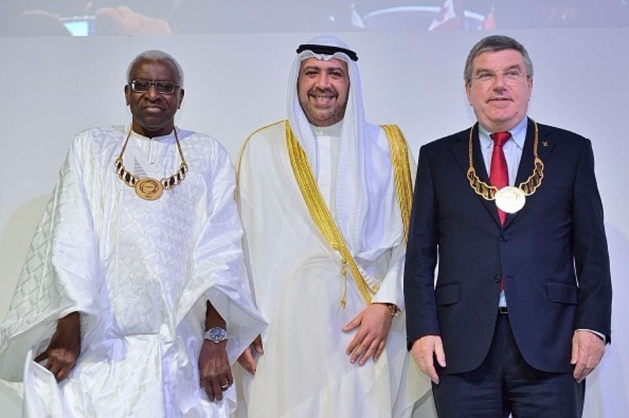 Lamine Diack (left) and Thomas Bach (right) each pictured receiving ANOC Merit Awards at the 2014 ANOC General Assembly in Bangkok ©Getty Images