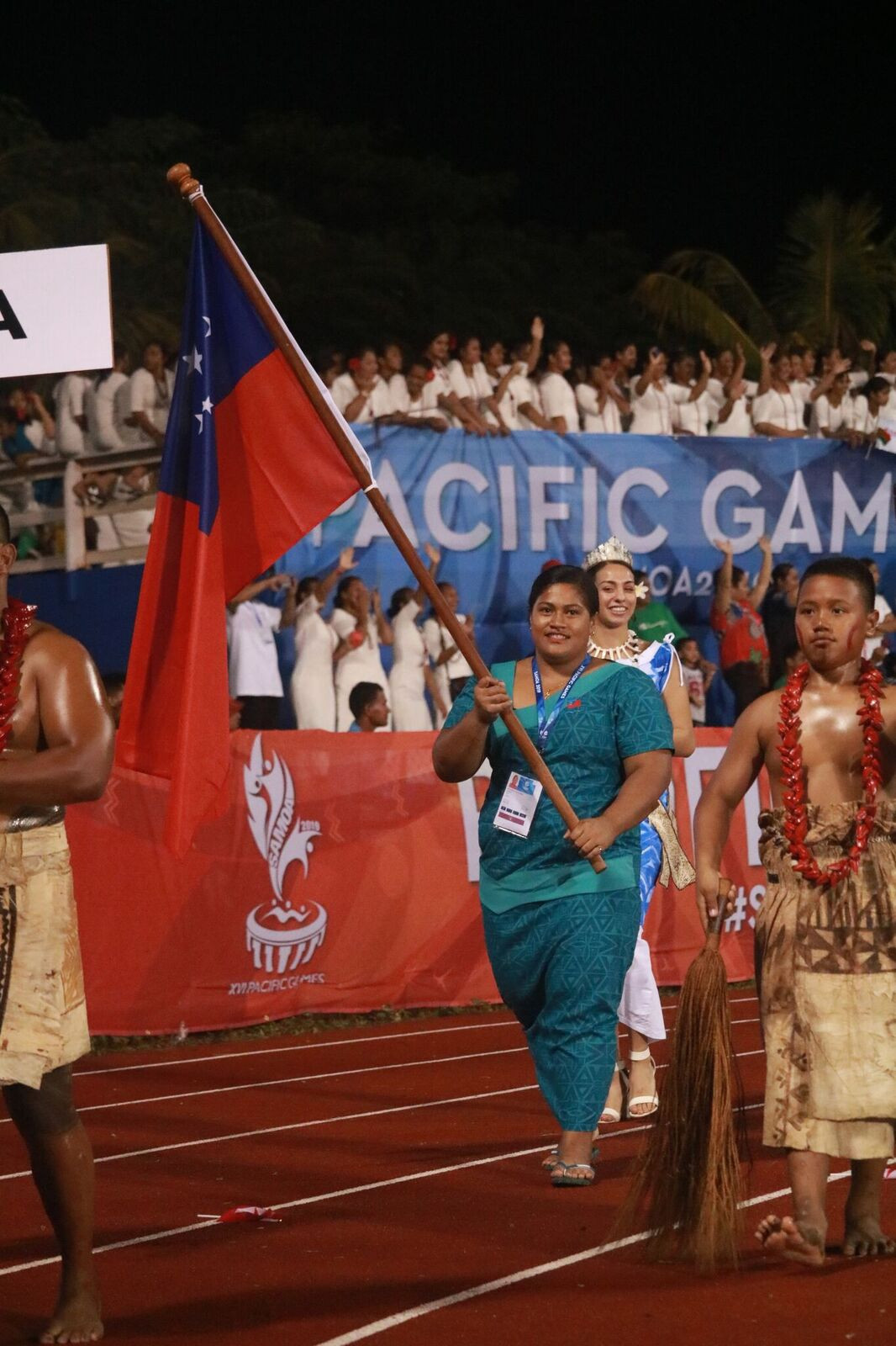 The Samoan team are led out by weightlifter Feagaiga Stowers at the Pacific Games Opening Ceremony ©Roland Setu/Games News Service