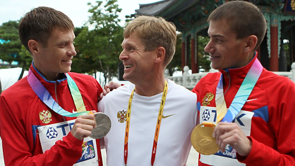 Viktor Chegin, centre, has been banned for life from any involvement in the sport of athletics ©Getty Images
