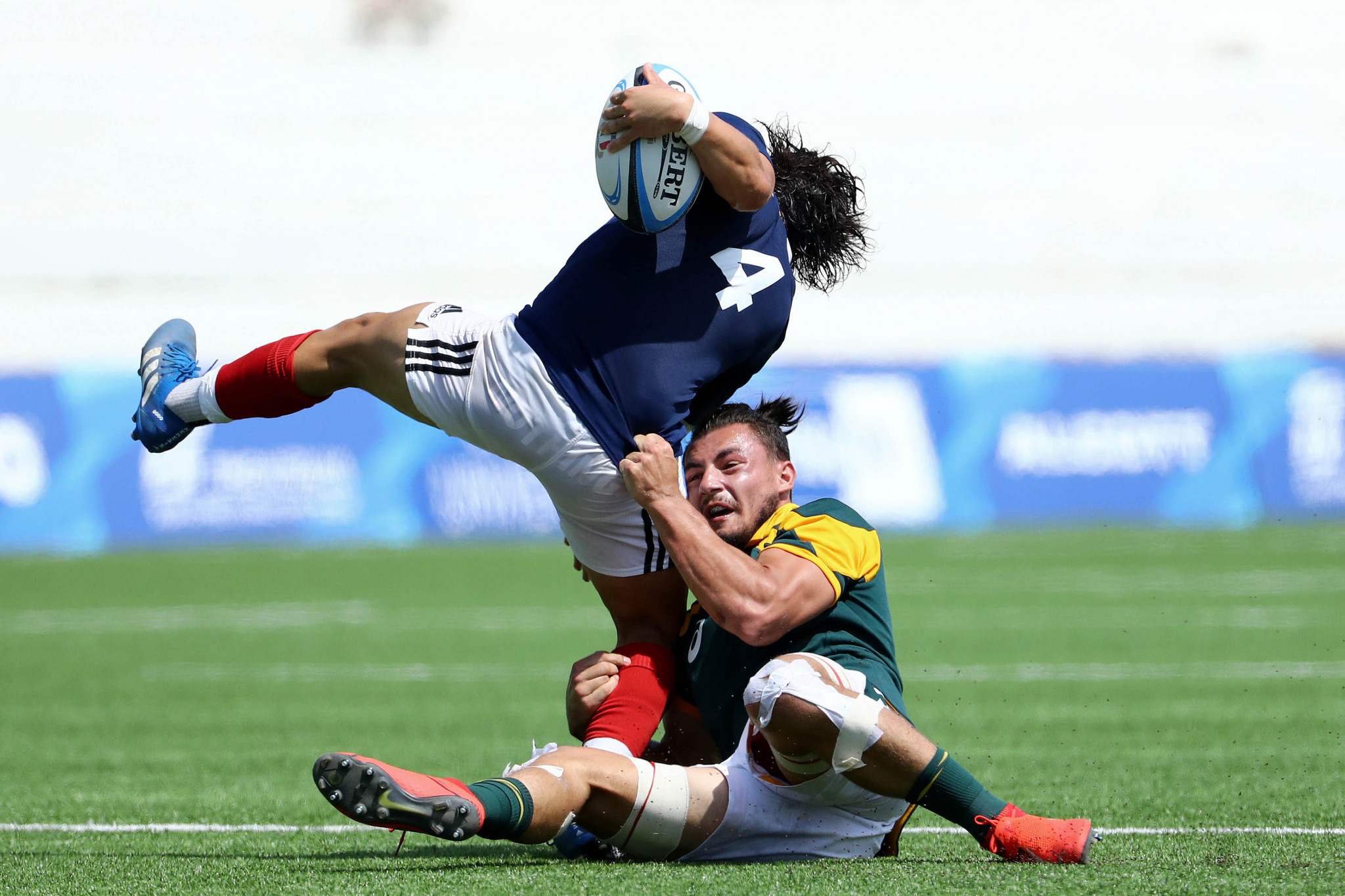 Dorian Bellot of France and South Africa's Bernard van der Linde in action on day five ©Getty Images
