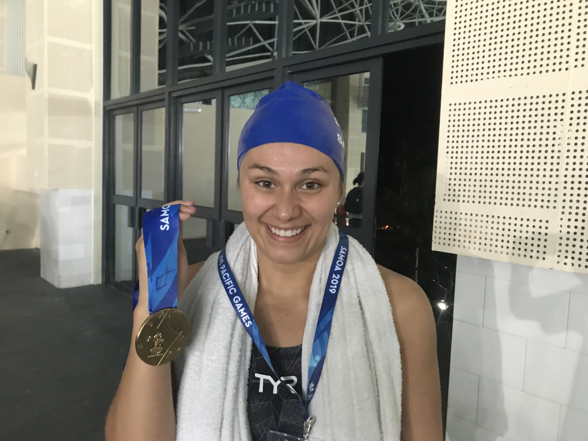 Lauren Sale celebrates victory in the 200m women's backstroke to become Samoa's first female swimming Pacific Games champion on a memorable night in the pool for the hosts ©ITG