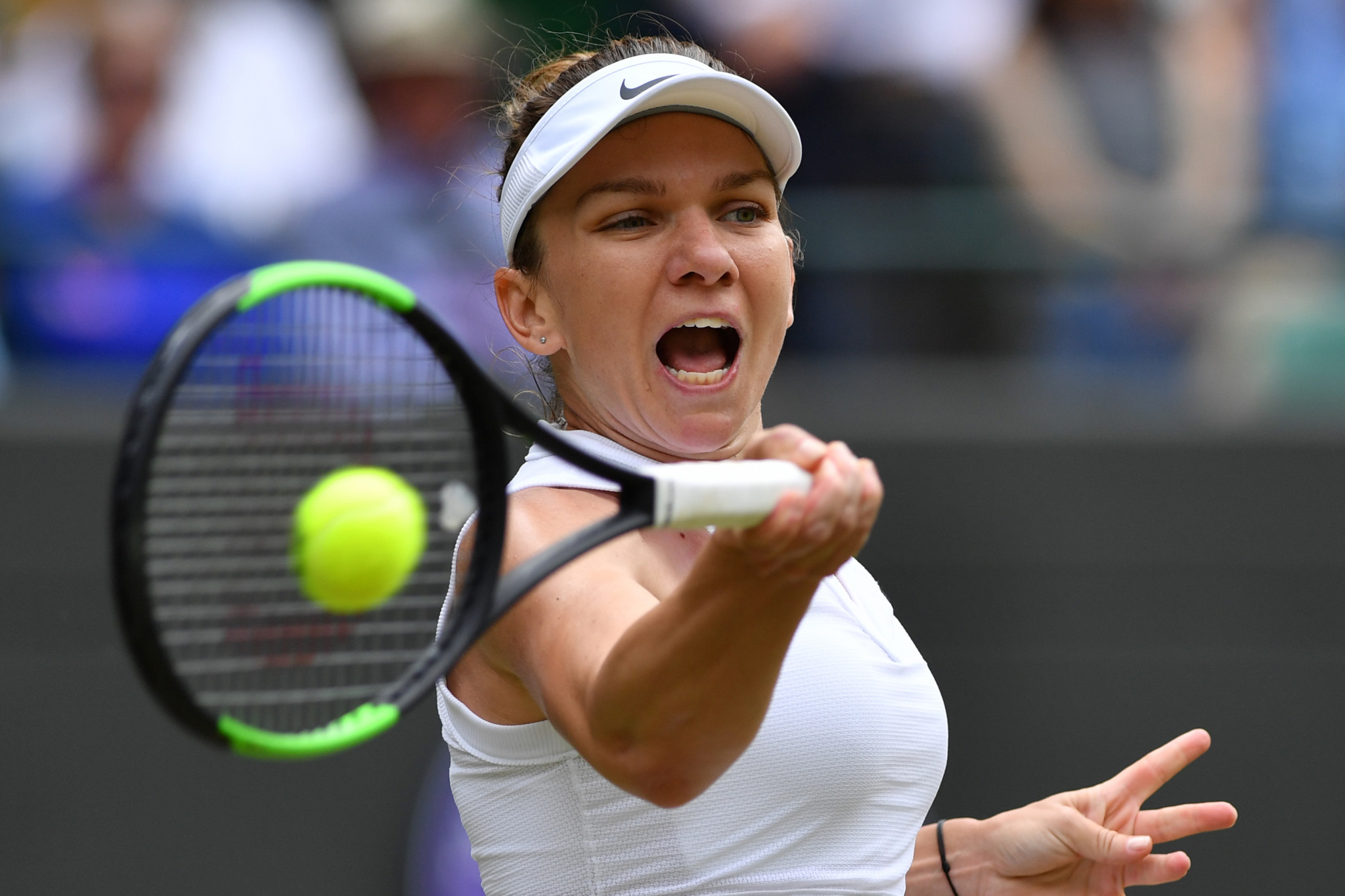 Romania's Simona Halep is through to the last four after defeating China's Zhang Shuai 7-6, 6-1 ©Getty Images