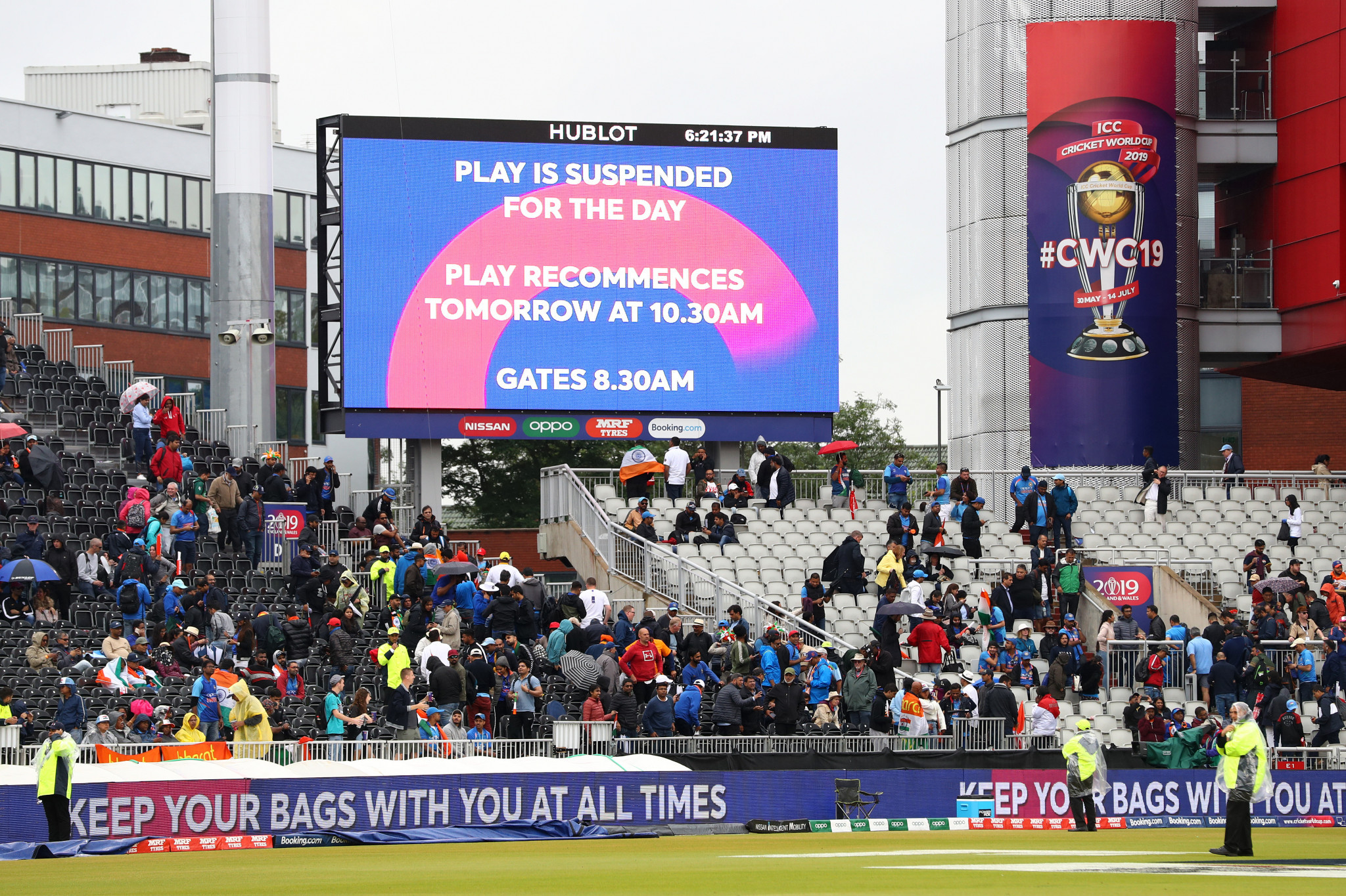 Rain forces ICC Cricket World Cup semi-final between India and New Zealand to be abandoned for day
