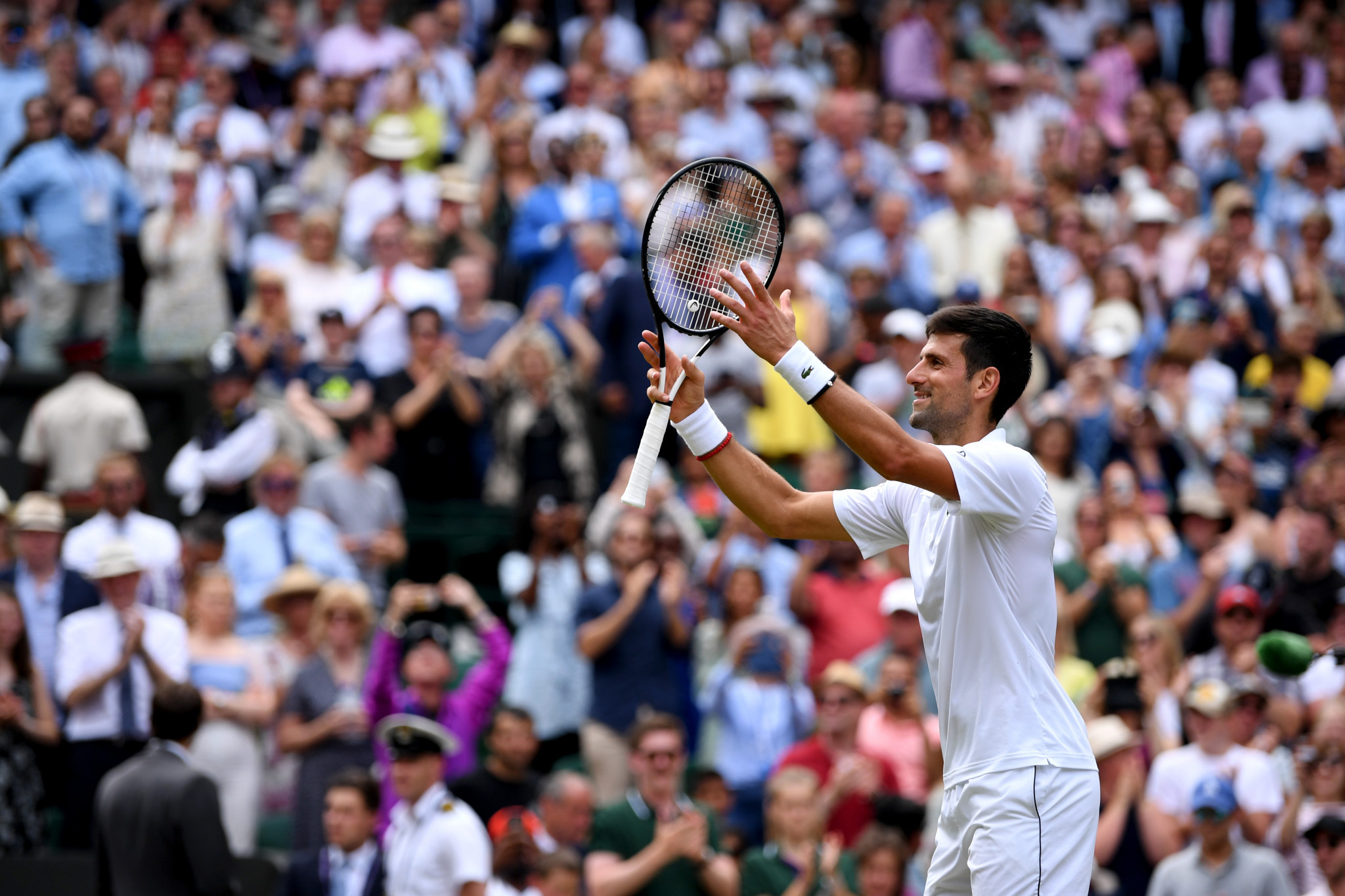 Defending champion Novak Djokovic eased to a straight-sets win over David Goffin to secure his place in the semi-finals of Wimbledon today ©Getty Images