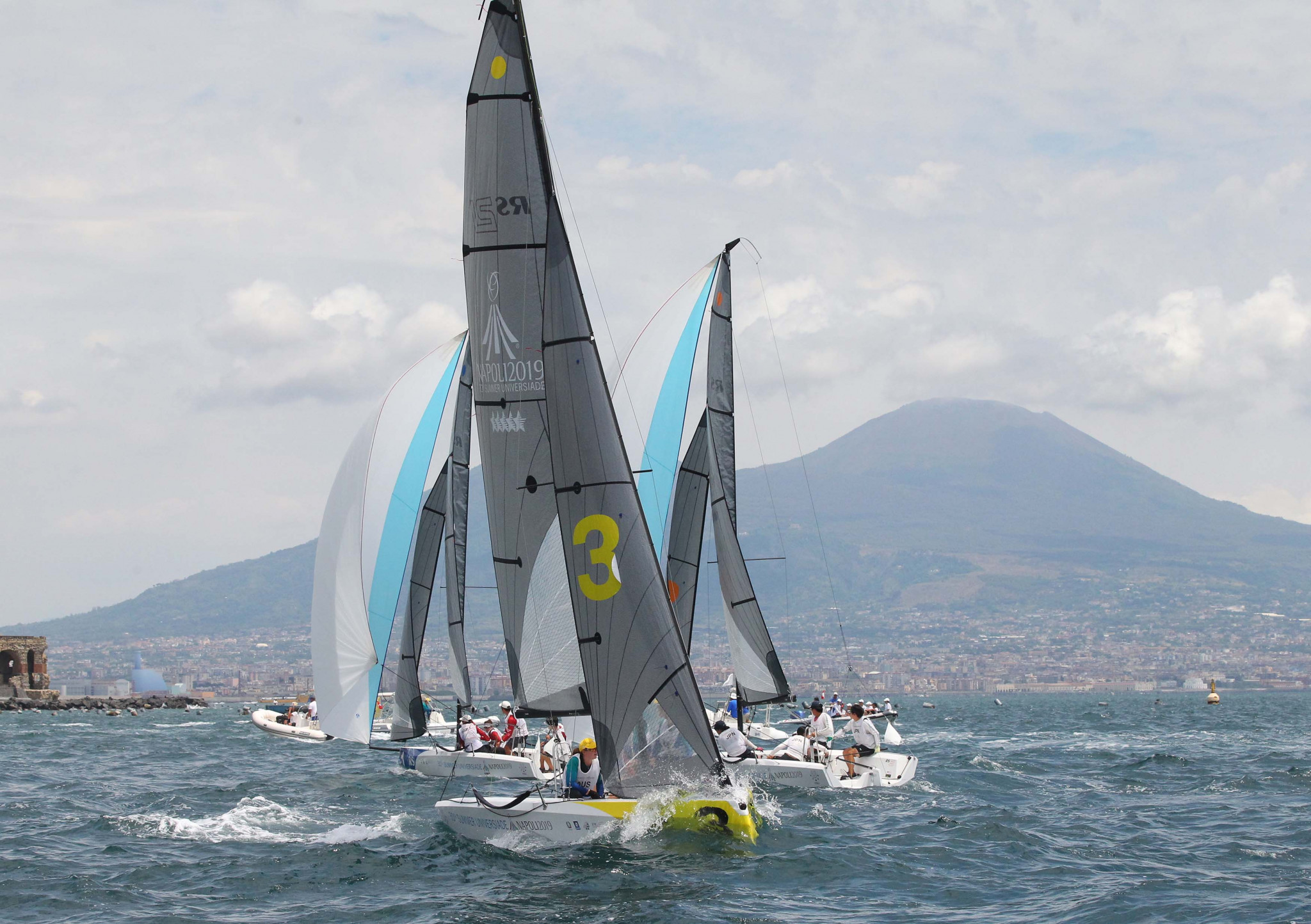 Sailors compete in the mixed fleet racing in the Bay of Naples ©Naples 2019