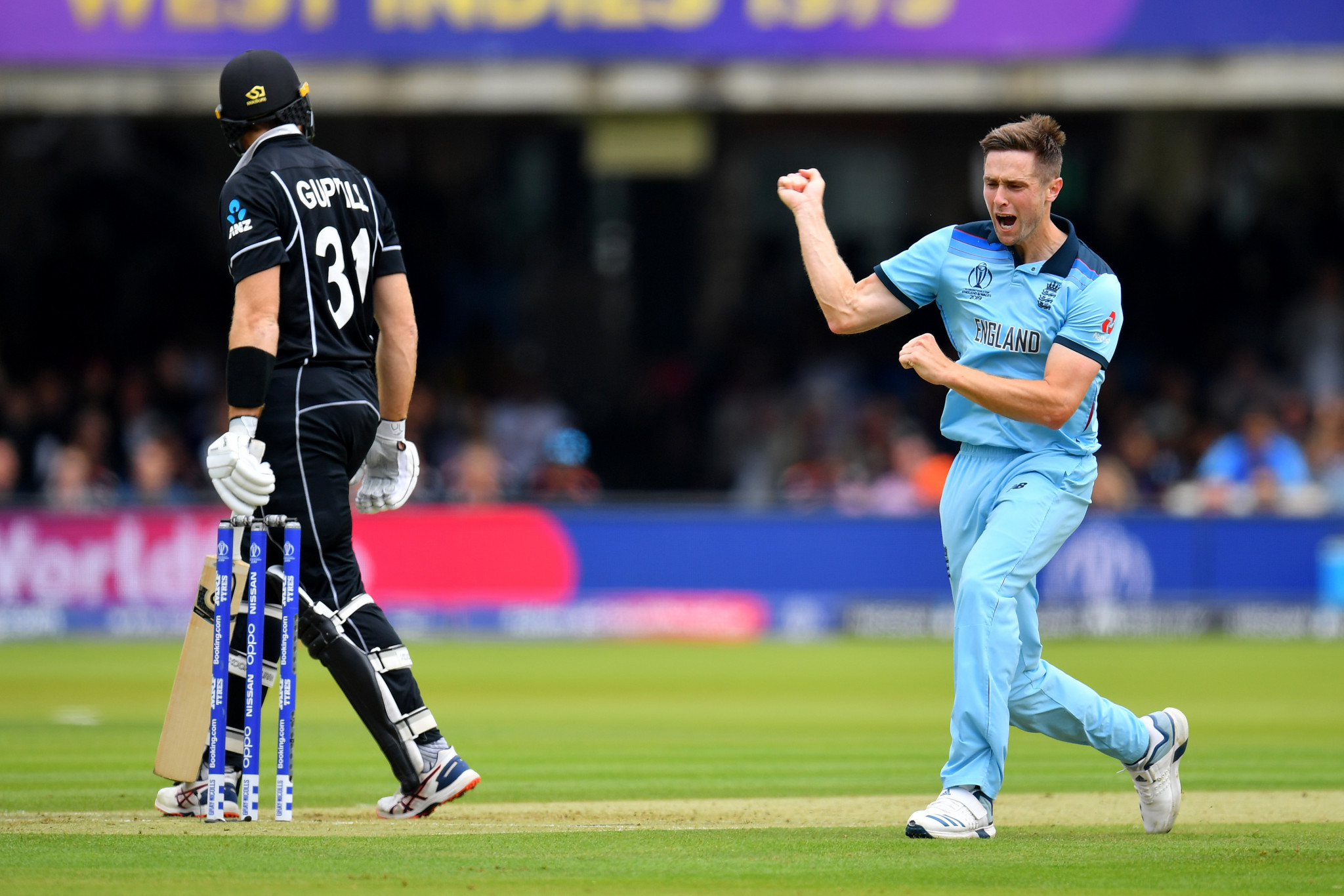 Chris Woakes celebrates one of his three wickets as England restricted New Zealand to a total of 241 runs - a total that his side equalled to set up the dramatic climax to the match ©Getty Images