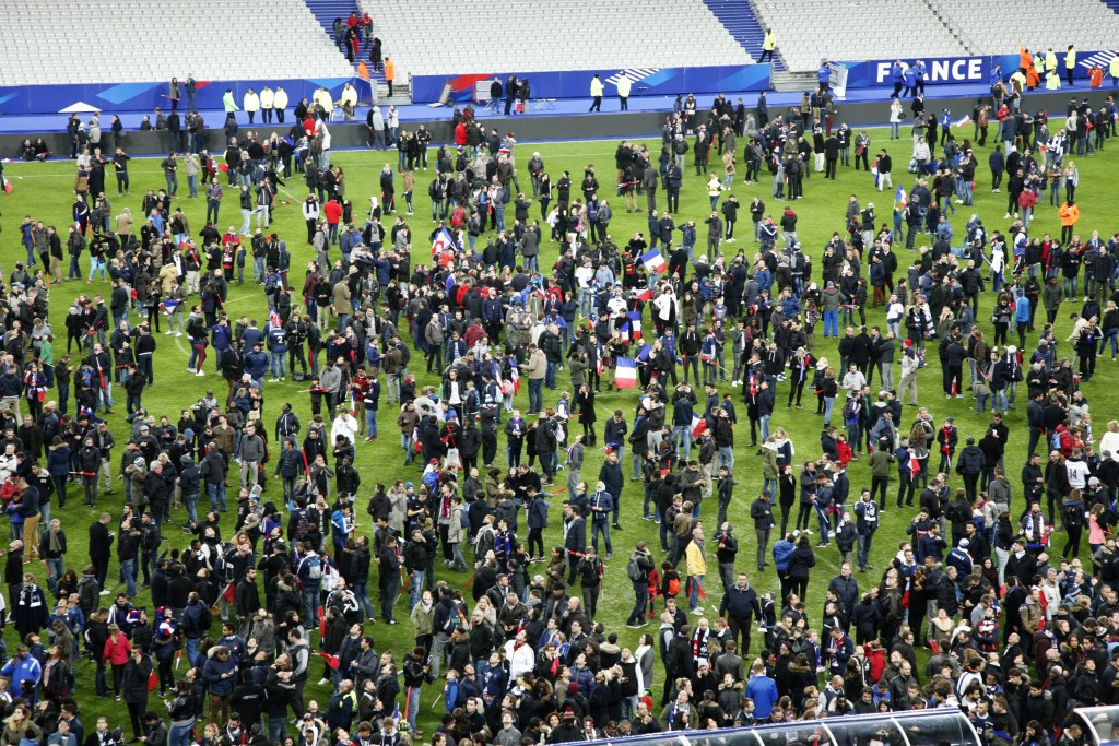 Fans inside the Stade de France heard three explosions and spilled onto the pitch 