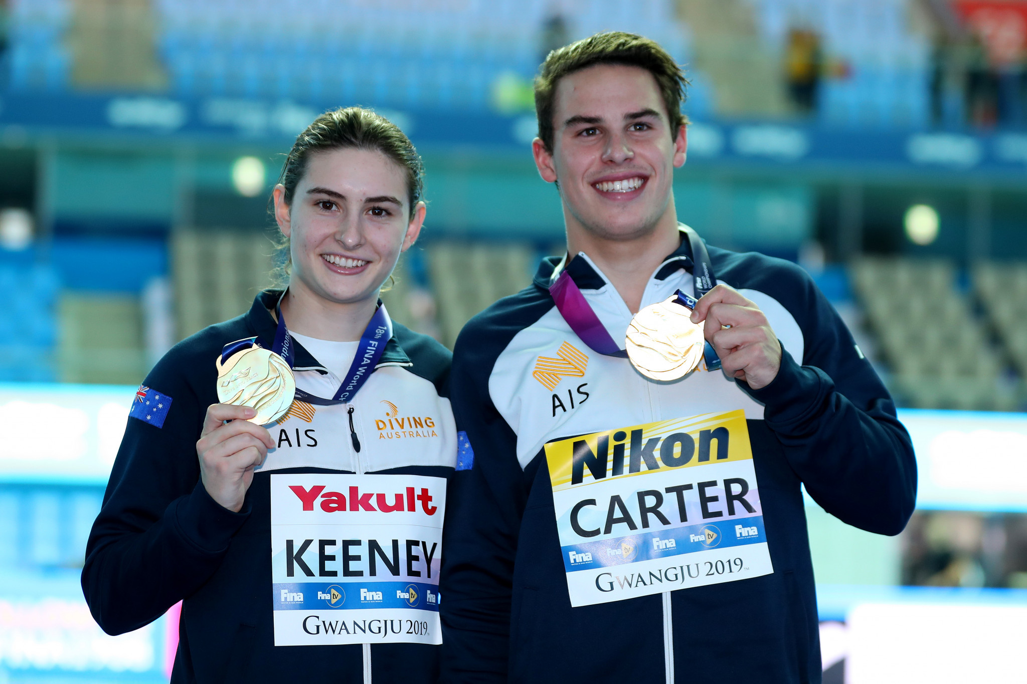 Gold medallists Maddison Keeney and Matthew Carter of Australia pose during the medal ceremony for the mixed 3m synchro springboard final ©Getty Images 