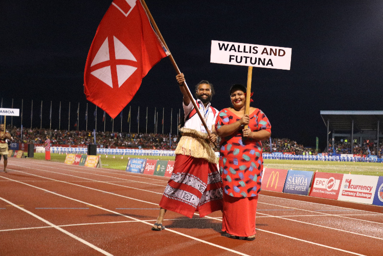 Flagbearers appeared first with athletes following later in the parade ©Pacific Games News Service