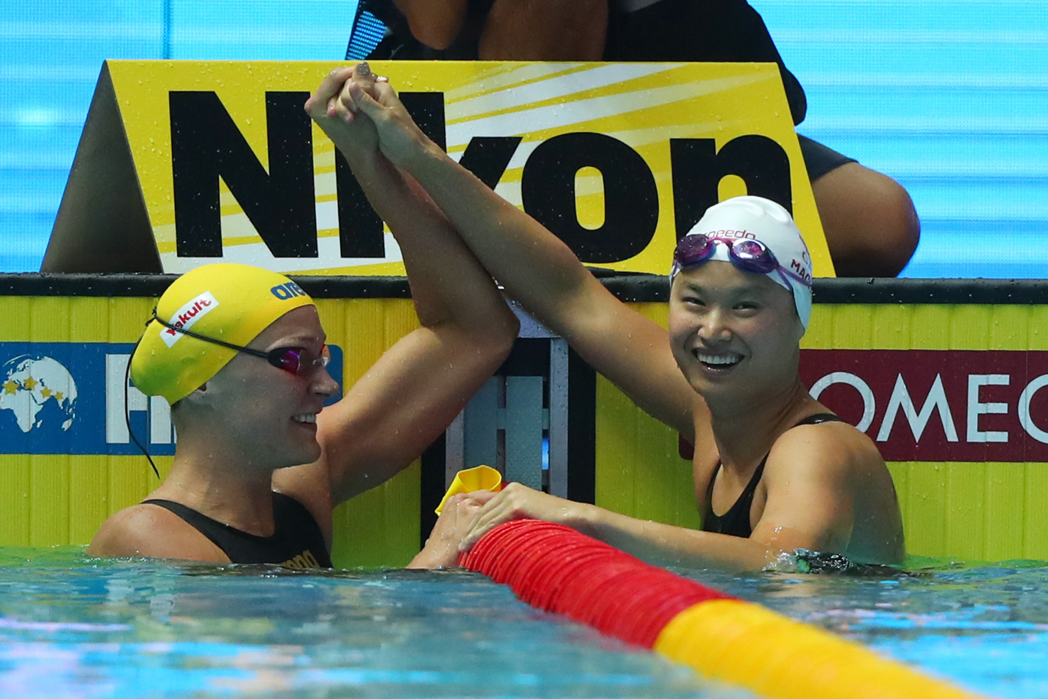 Canada's Maggie MacNeil, right, and Sarah Sjöström of Sweden were all smiles after claiming gold and silver medals respectively in the women's 100m butterfly final in Gwangju ©Getty Images 