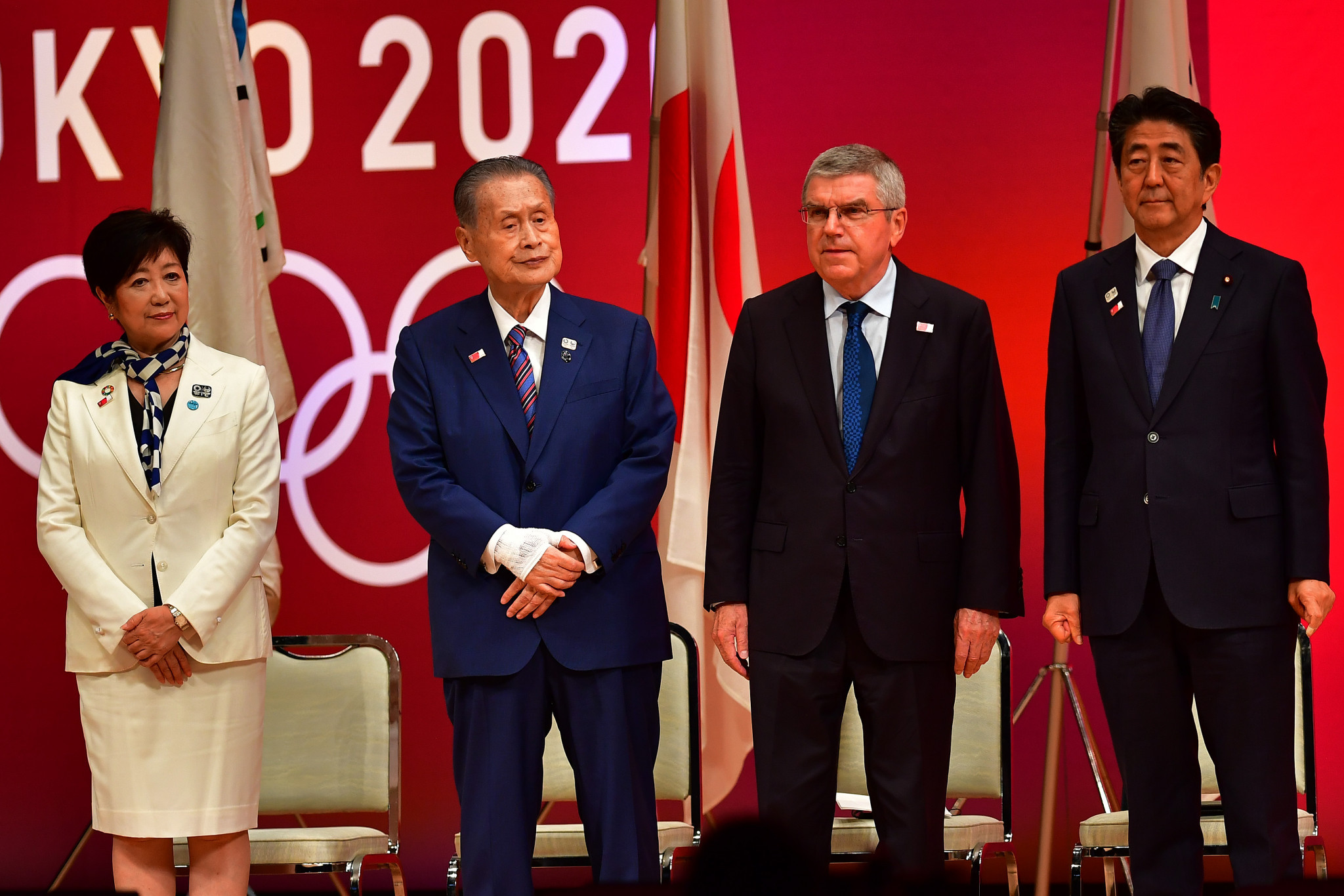 Koike, left, was joined by the likes of Tokyo 2020 President Yoshirō Mori, IOC counterpart Thomas Bach and Japan's Prime Minister Shinzō Abe ©Getty Images