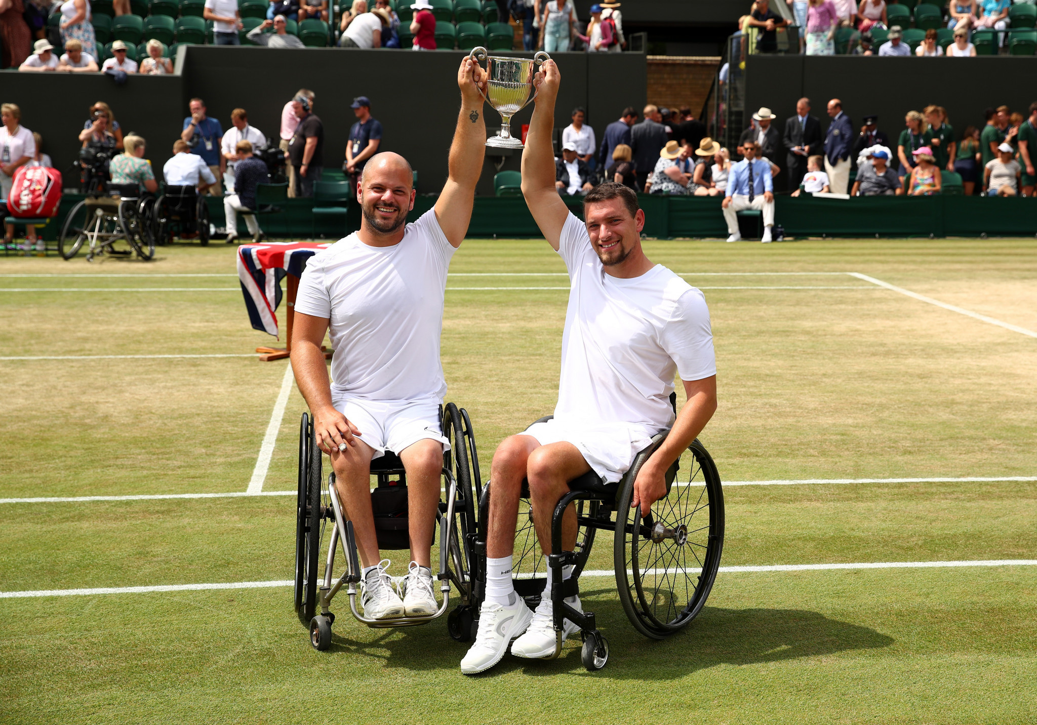 Joachim Gerard of Belgium and Sweden's Stefan Olsson celebrate victory in the men's wheelchair tennis doubles final at Wimbledon ©Getty Images